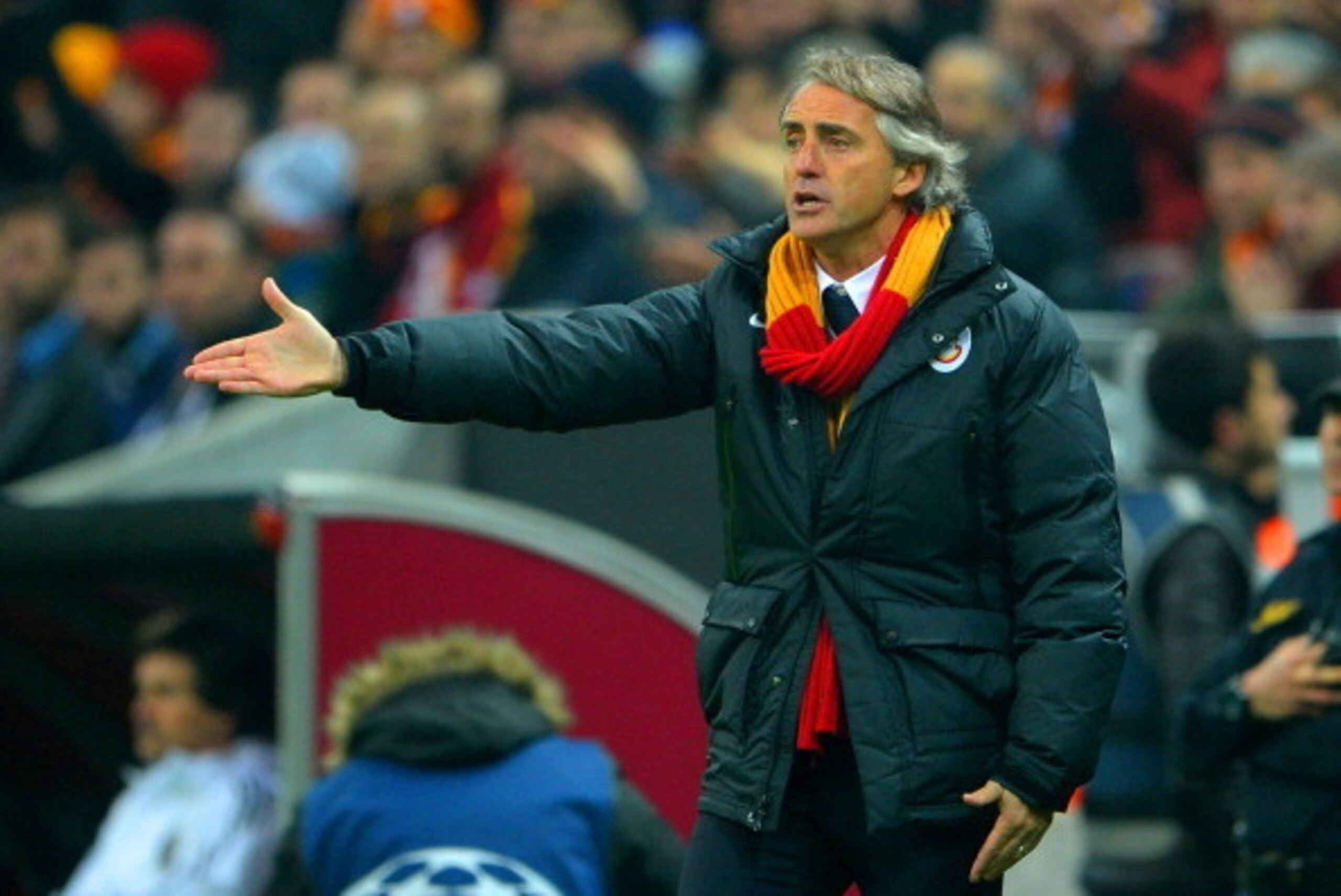 ISTANBUL, TURKEY - FEBRUARY 26: Head Coach Roberto Mancini of Galatasaray gives instructions  during the UEFA Champions League Round of 16 first leg match between Galatasaray AS and Chelsea at Ali Sami Yen Arena on February 26, 2014 in Istanbul, Turkey.  
