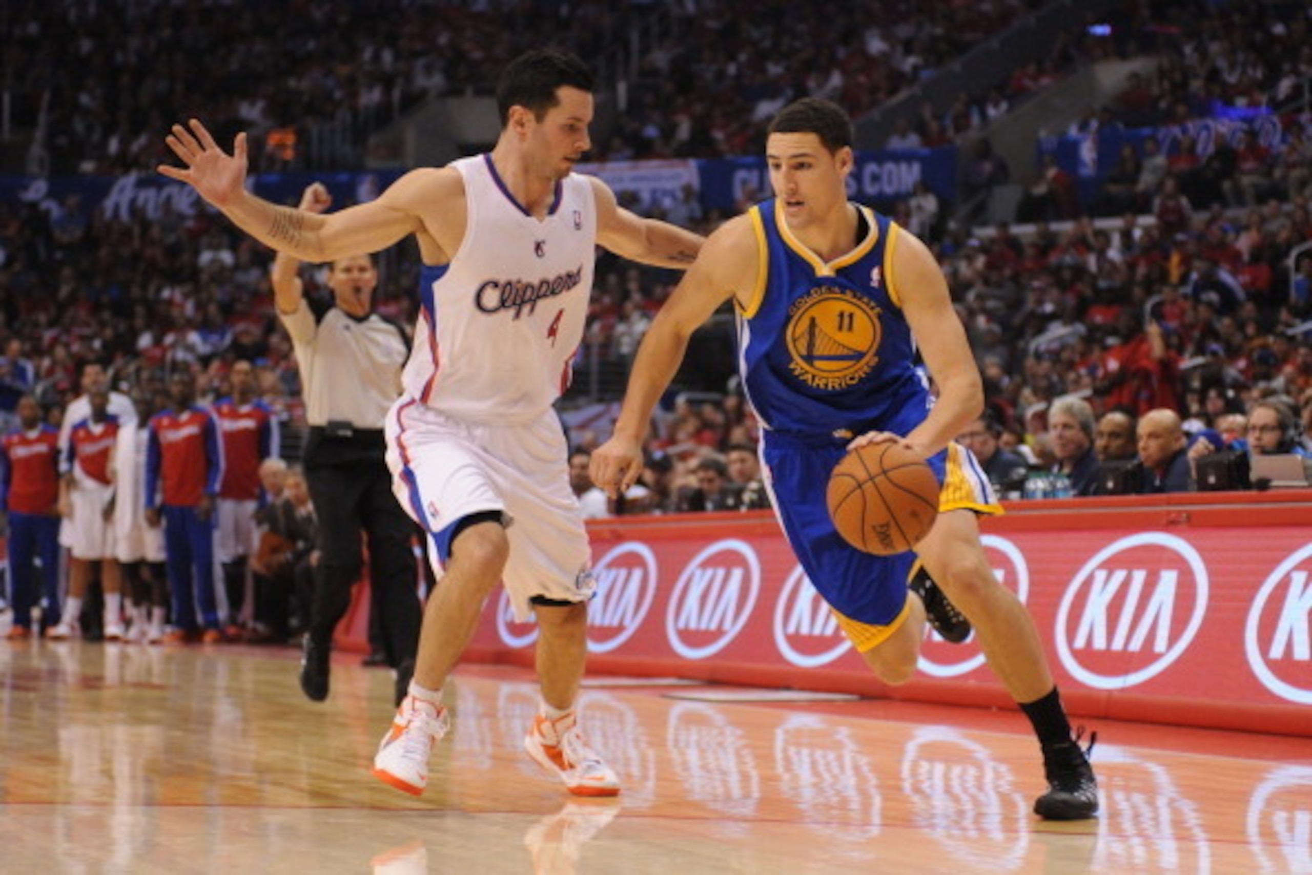 LOS ANGELES, CA - OCTOBER 31: Klay Thompson #11 of the Golden State Warriors drives to the basket against J.J. Redick #4 of the Los Angeles Clippers at STAPLES Center on October 31, 2013 at in Los Angeles, California. NOTE TO USER: User expressly acknowle