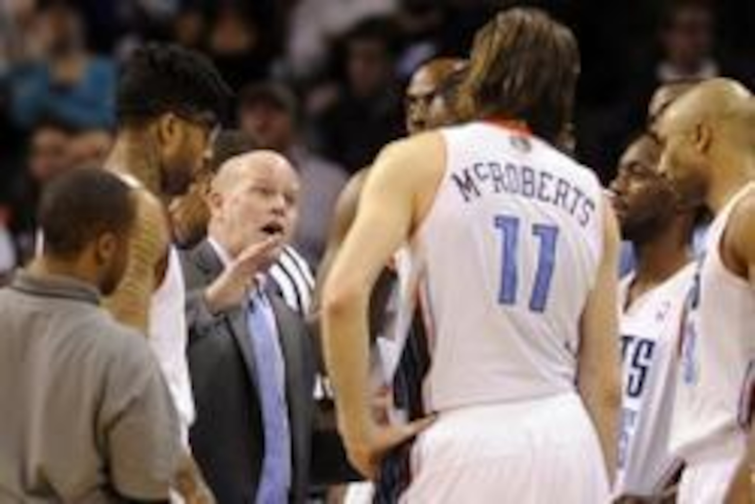 Apr 16, 2014; Charlotte, NC, USA; Charlotte Bobcats head coach Steve Clifford talks to his team in a time out during the second half of the game against the Chicago Bulls at Time Warner Cable Arena. Bobcats win in overtime 91-86. Mandatory Credit: Sam Sha