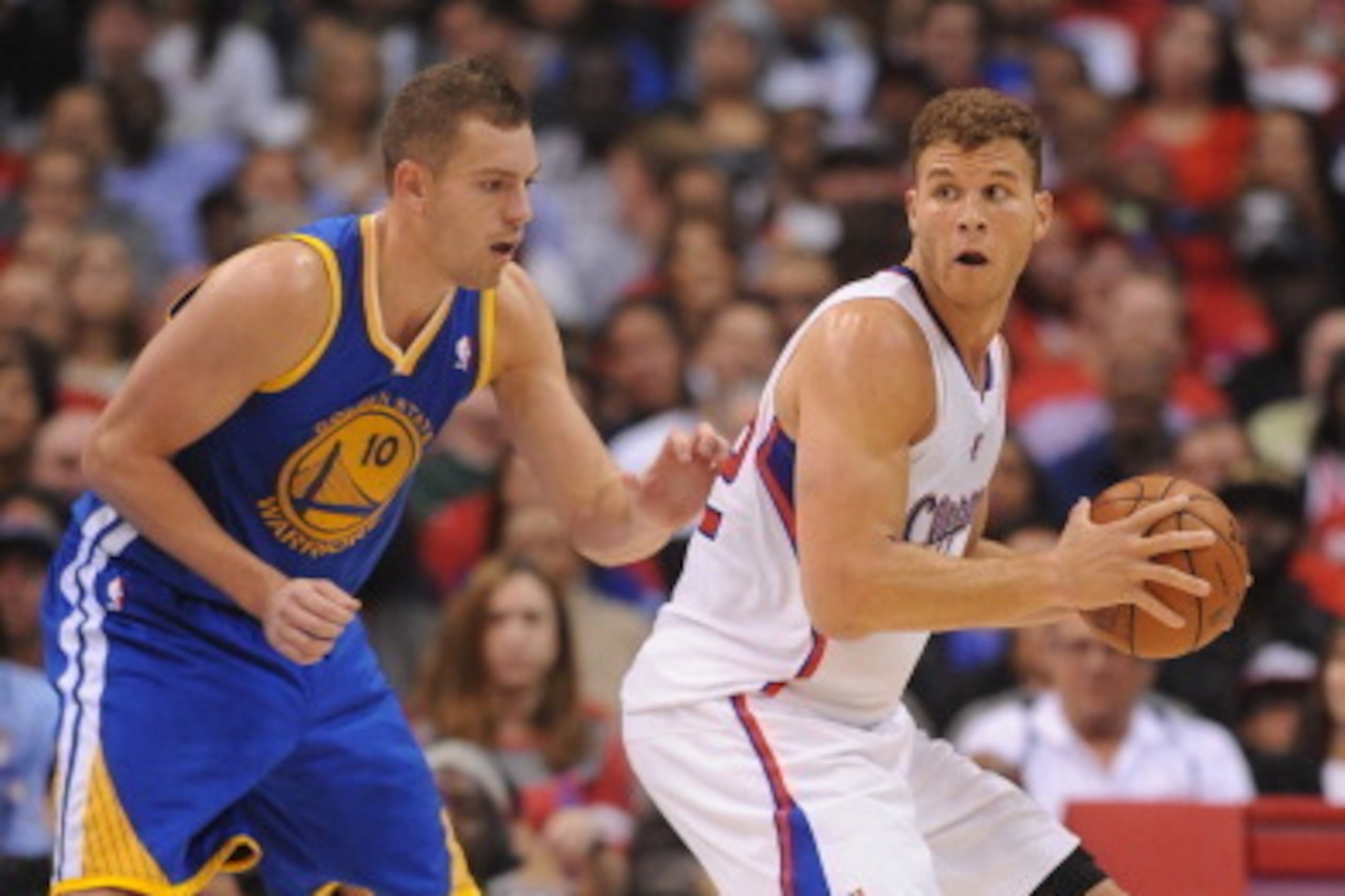 LOS ANGELES, CA - OCTOBER 31: Blake Griffin #32 of the Los Angeles Clippers handles the ball against David Lee #10 of the Golden State Warriors at STAPLES Center on October 31, 2013 at in Los Angeles, California. NOTE TO USER: User expressly acknowledges 