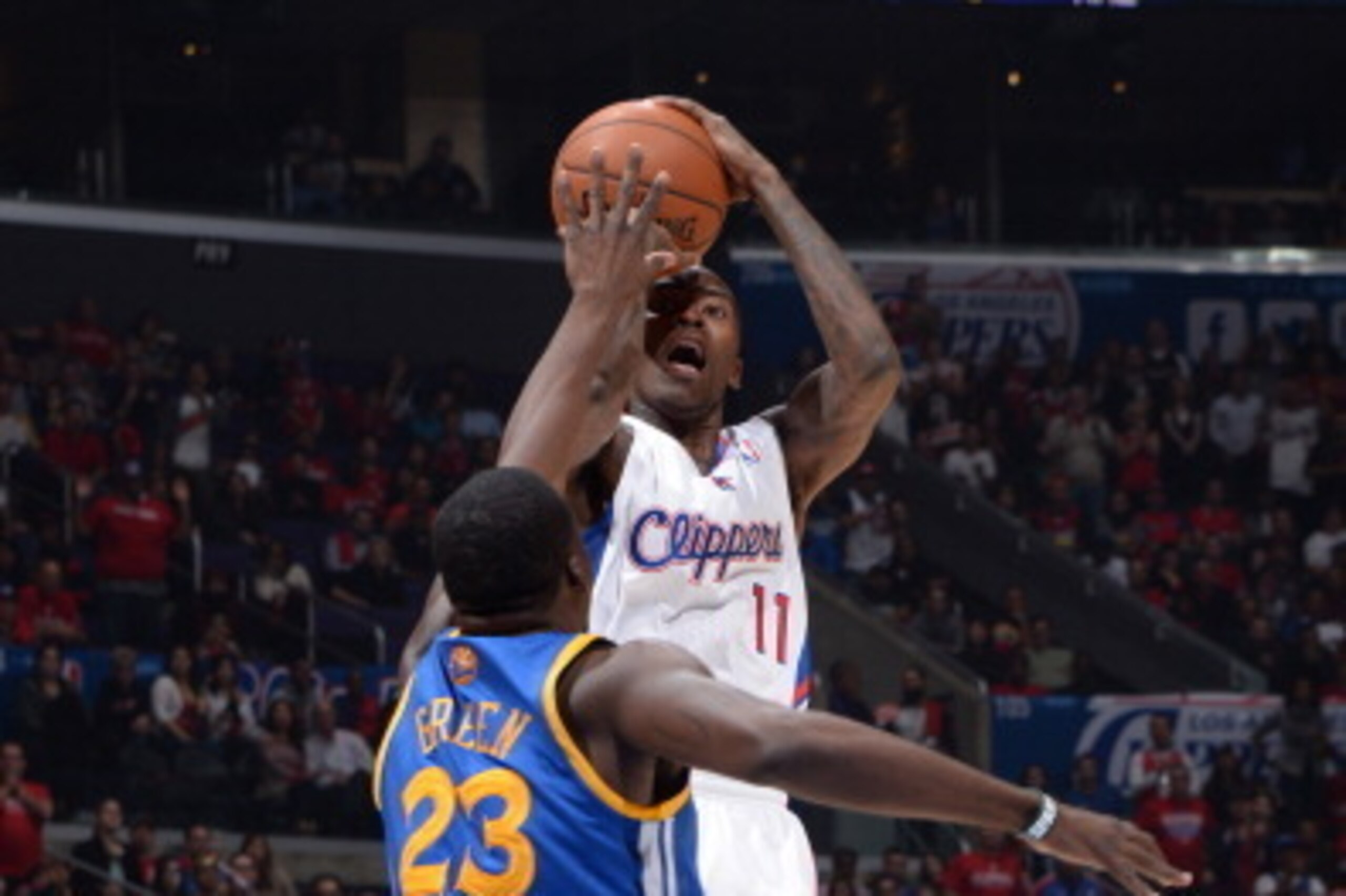 LOS ANGELES, CA - OCTOBER 31: Jamal Crawford #11 of the Los Angeles Clippers attempts a shot against Draymond Green #23 of the Golden State Warriors at STAPLES Center on October 31, 2013 at in Los Angeles, California. NOTE TO USER: User expressly acknowle