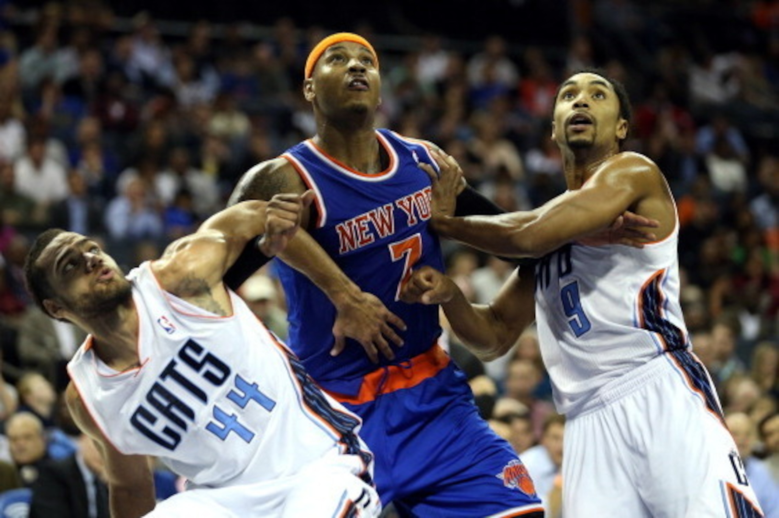CHARLOTTE, NC - DECEMBER 05:  Teammates Jeffery Taylor #44 of the Charlotte Bobcats and Gerald Henderson #9 try to block out Carmelo Anthony #7 of the New York Knicks during their game at Time Warner Cable Arena on December 5, 2012 in Charlotte, North Car