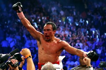 LAS VEGAS, NV - DECEMBER 08:  Juan Manuel Marquez celebrates after defeating Manny Pacquiao by a sixth round knockout in their welterweight bout at the MGM Grand Garden Arena on December 8, 2012 in Las Vegas, Nevada.  (Photo by Al Bello/Getty Images)