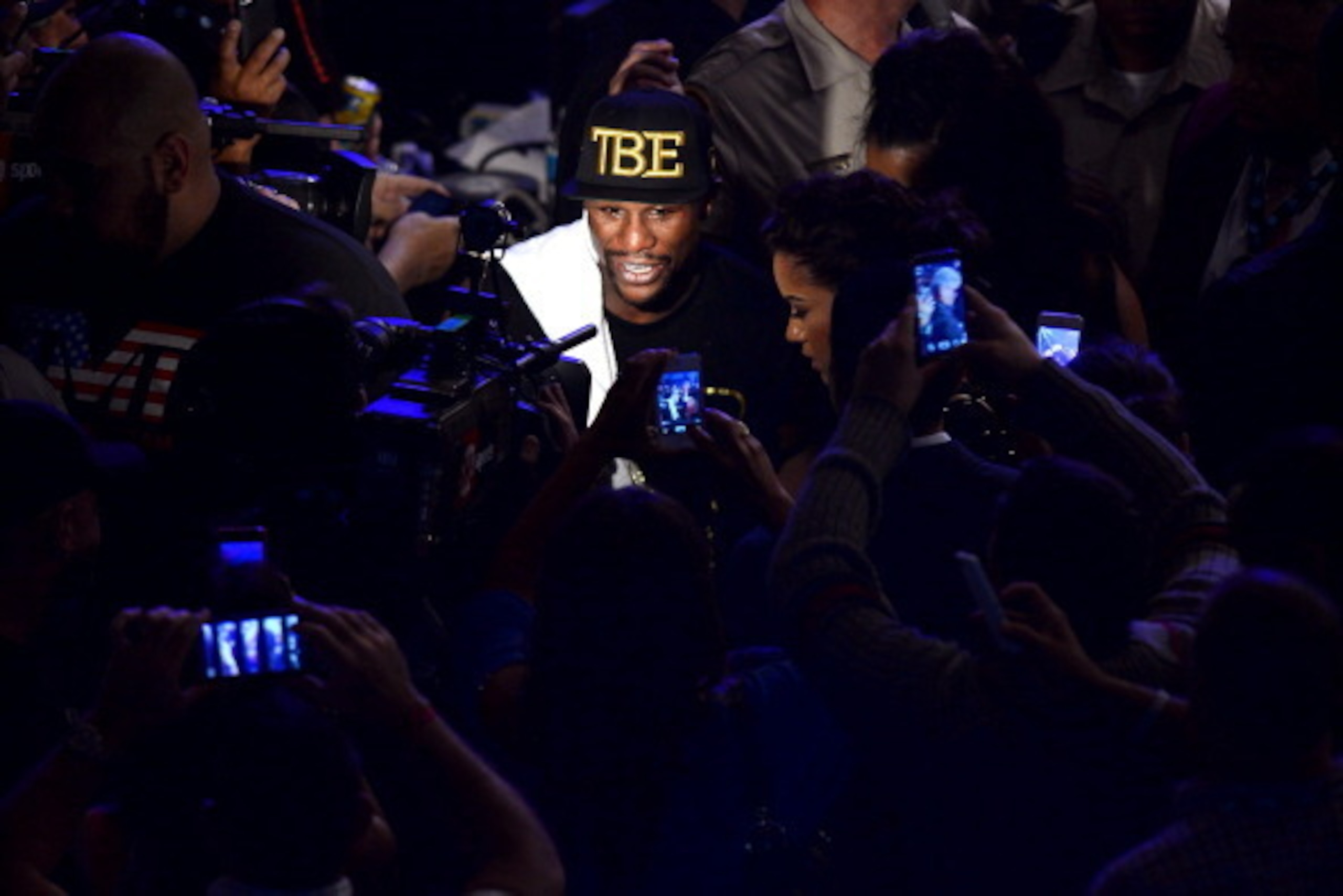 LAS VEGAS, NV - SEPTEMBER 14:  Floyd Mayweather Jr. celebrates his majority decision victory against Canelo Alvarez in their WBC/WBA 154-pound title fight at the MGM Grand Garden Arena on September 14, 2013 in Las Vegas, Nevada.  (Photo by Ethan Miller/Ge
