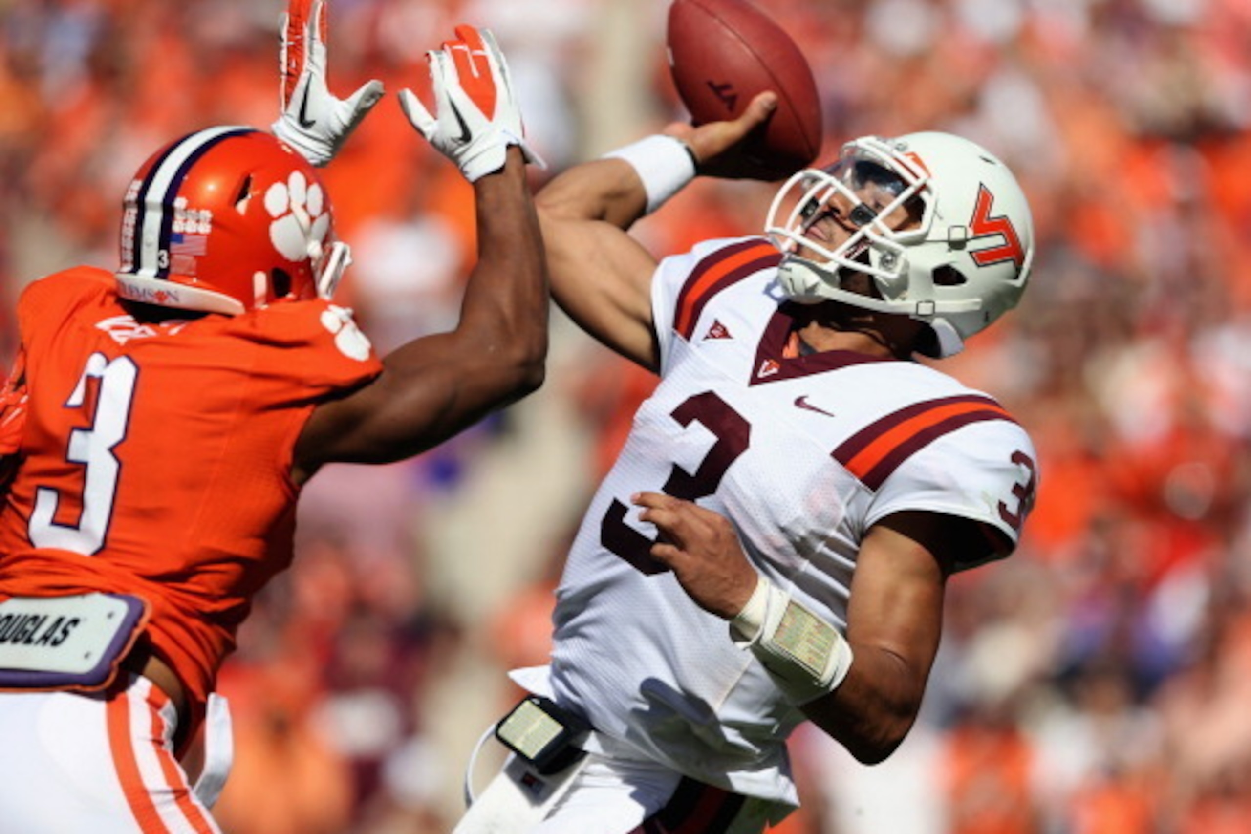 CLEMSON, SC - OCTOBER 20:  Vic Beasley #3 of the Clemson Tigers goes after Logan Thomas #3 of the Virginia Tech Hokies as he tries to pass the ball during their game at Clemson Memorial Stadium on October 20, 2012 in Clemson, South Carolina.  (Photo by St