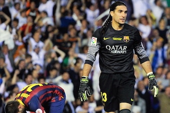VALENCIA, SPAIN - APRIL 16:  Jose Manuel Pinto of FC Barcelona reacts after Angel Di Maria of Real Madrid CF scored the opening goal during the Copa del Rey Final between Real Madrid and FC Barcelona at Estadio Mestalla on April 16, 2014 in Valencia, Spai