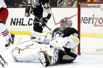 PITTSBURGH, PA - APRIL 16:  Marc-Andre Fleury #29 of the Pittsburgh Penguins reacts after allowing a goal against Mark Letestu #55 of the Columbus Blue Jackets  in Game One of the First Round of the 2014 NHL Stanley Cup Playoffs at Consol Energy Center on