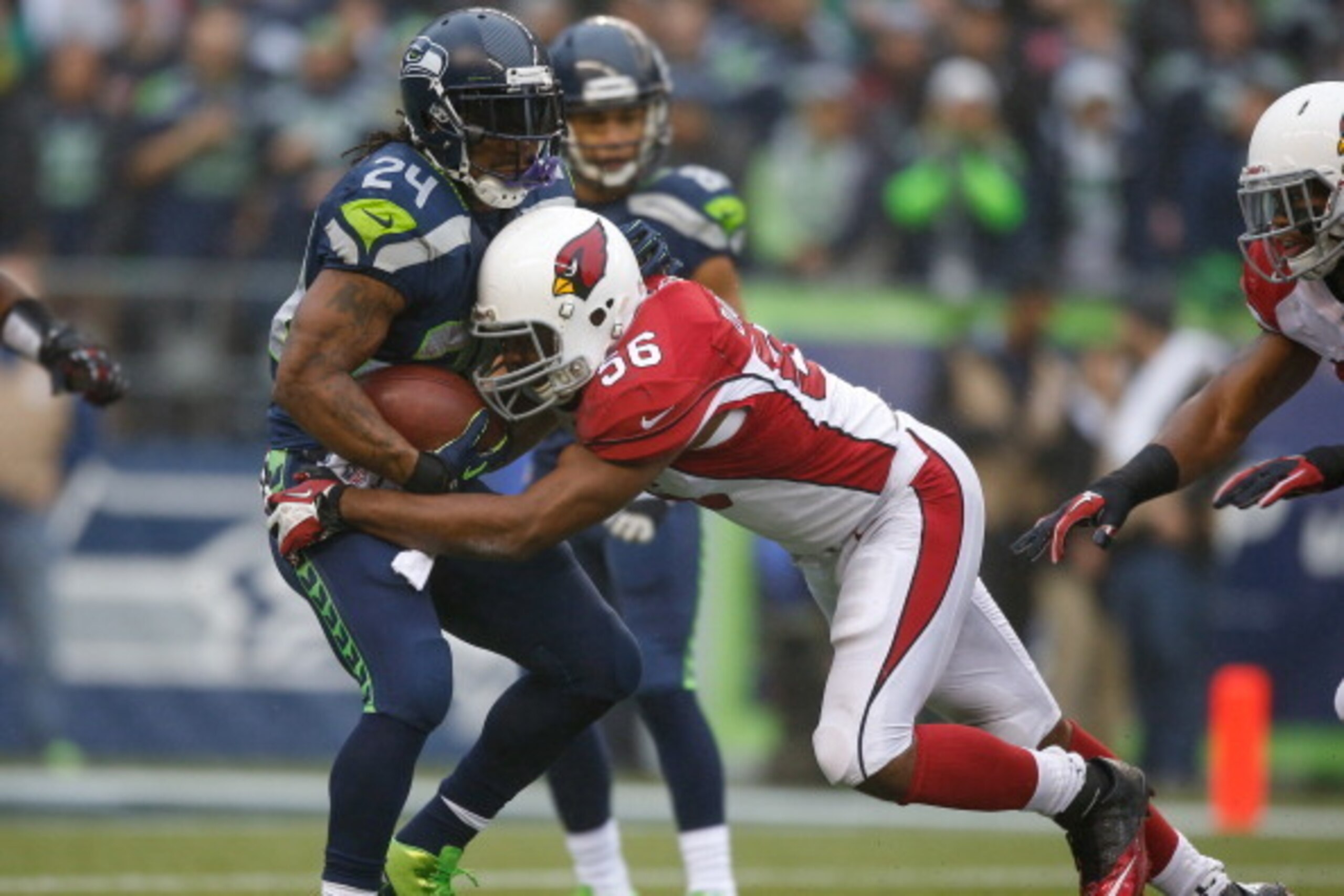 SEATTLE, WA - DECEMBER 22: Running back Marshawn Lynch #24 of the Seattle Seahawks is tackled by Karlos Dansby #56 of the Arizona Cardinals at CenturyLink Field on December 22, 2013 in Seattle, Washington. (Photo by Otto Greule Jr/Getty Images) SEATTLE, WA - DECEMBER 22: Running back Marshawn Lynch #24 of the Seattle Seahawks is tackled by Karlos Dansby #56 of the Arizona Cardinals at CenturyLink Field on December 22, 2013 in Seattle, Washington. (Photo by Otto Greule Jr/Getty Images)