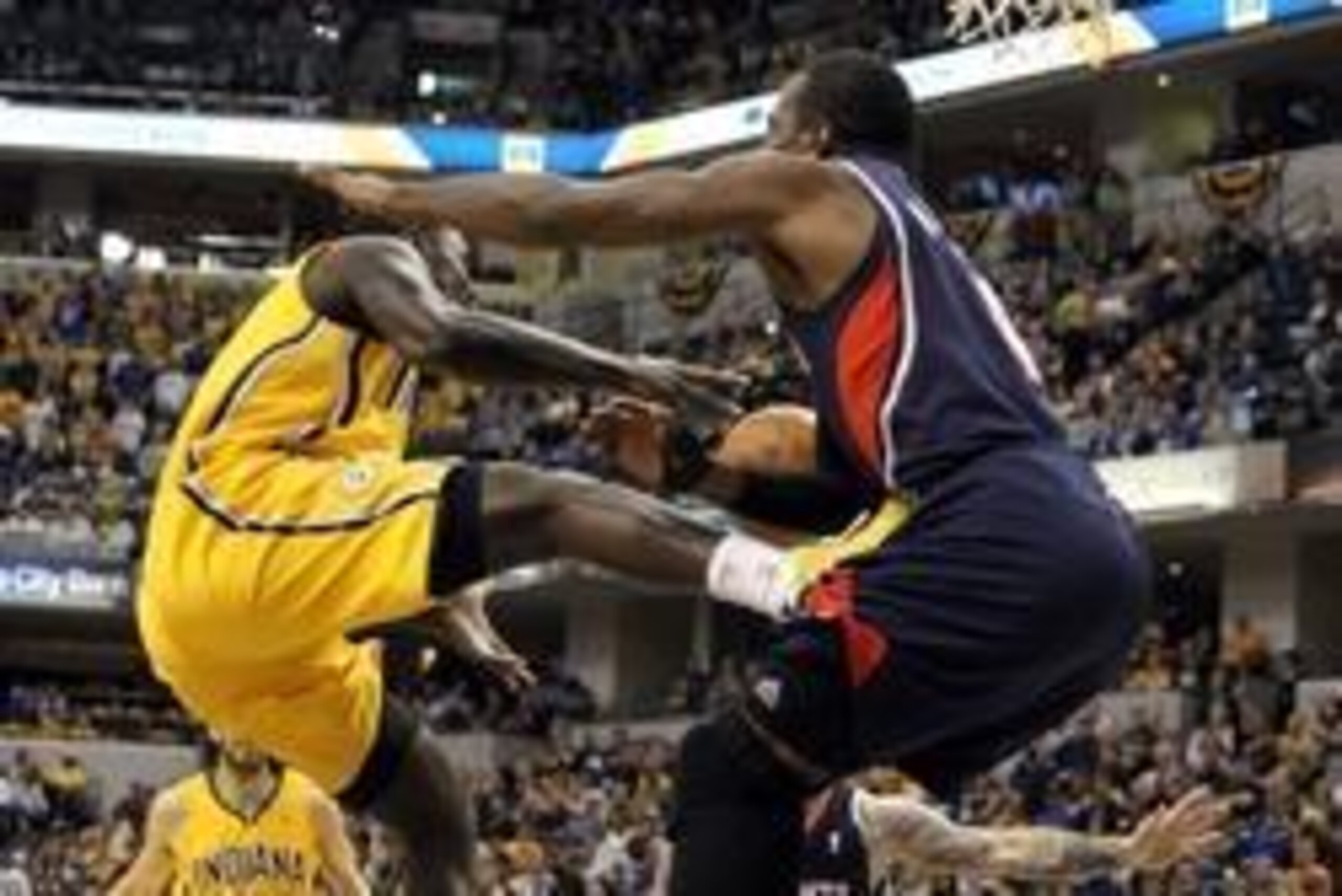 Apr 6, 2014; Indianapolis, IN, USA; Indiana Pacers guard Lance Stephenson (1) drives to the basket and runs into Atlanta Hawks forward Paul Millsap (4) during the fourth quarter at Bankers Life Fieldhouse. Atlanta won 107-88. Mandatory Credit: Pat Lovell-
