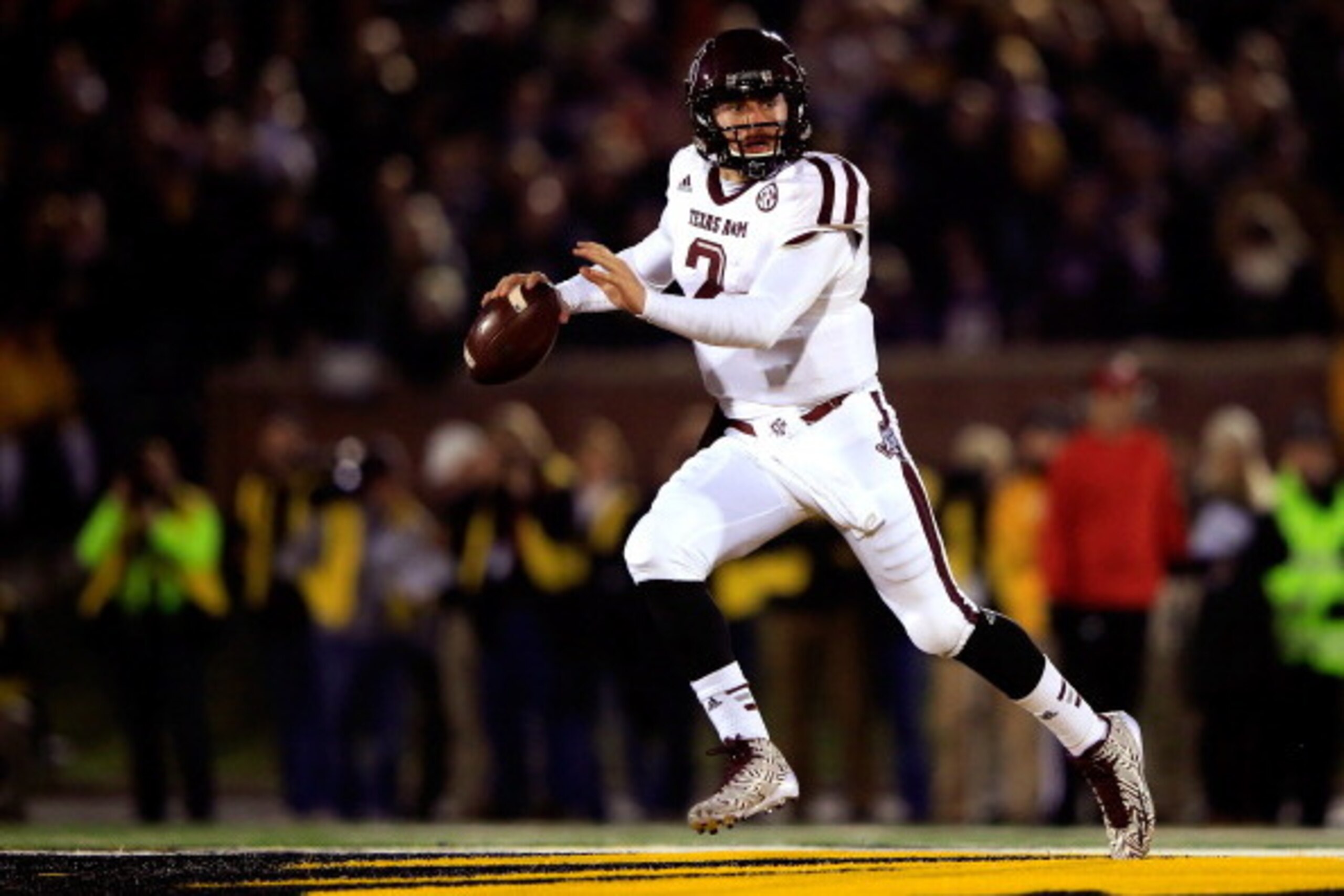 COLUMBIA, MO - NOVEMBER 30:  Quarterback Johnny Manziel #2 of the Texas A&M Aggies scrambles during the game against the Missouri Tigers on November 30, 2013 in Columbia, Missouri.  (Photo by Jamie Squire/Getty Images)
