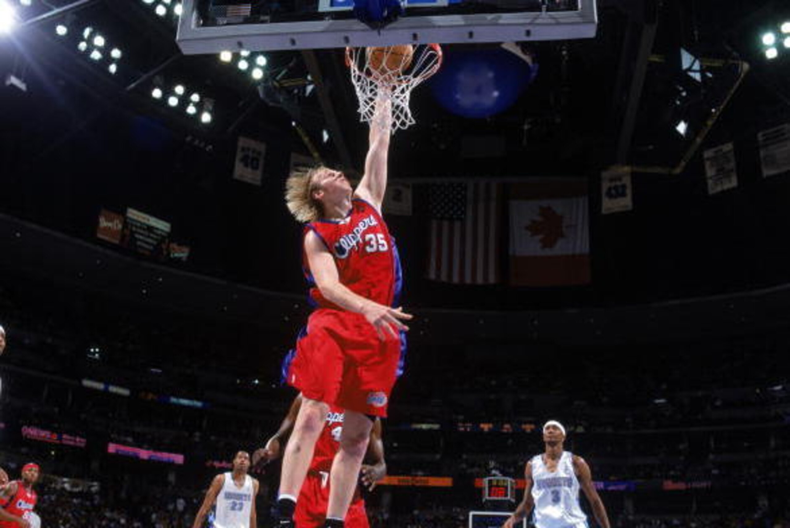 DENVER - MARCH 18:  Chris Kaman #35 of the Los Angeles Clippers dunks the ball during the game against the Denver Nuggets at Pepsi Center on March 18, 2005 in Denver, Colorado.  The Nuggets won 115-96.  NOTE TO USER: User expressly acknowledges and agrees