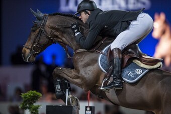 HONG KONG - MARCH 02:  Patrice Delaveau of France rides Lacrimoso 3 HDC at the Longines Grand Prix during the Longines Hong Kong Masters International Show Jumping at Asia World Expo on March 2, 2013 in Hong Kong, Hong Kong.  (Photo by Xaume Olleros/Getty