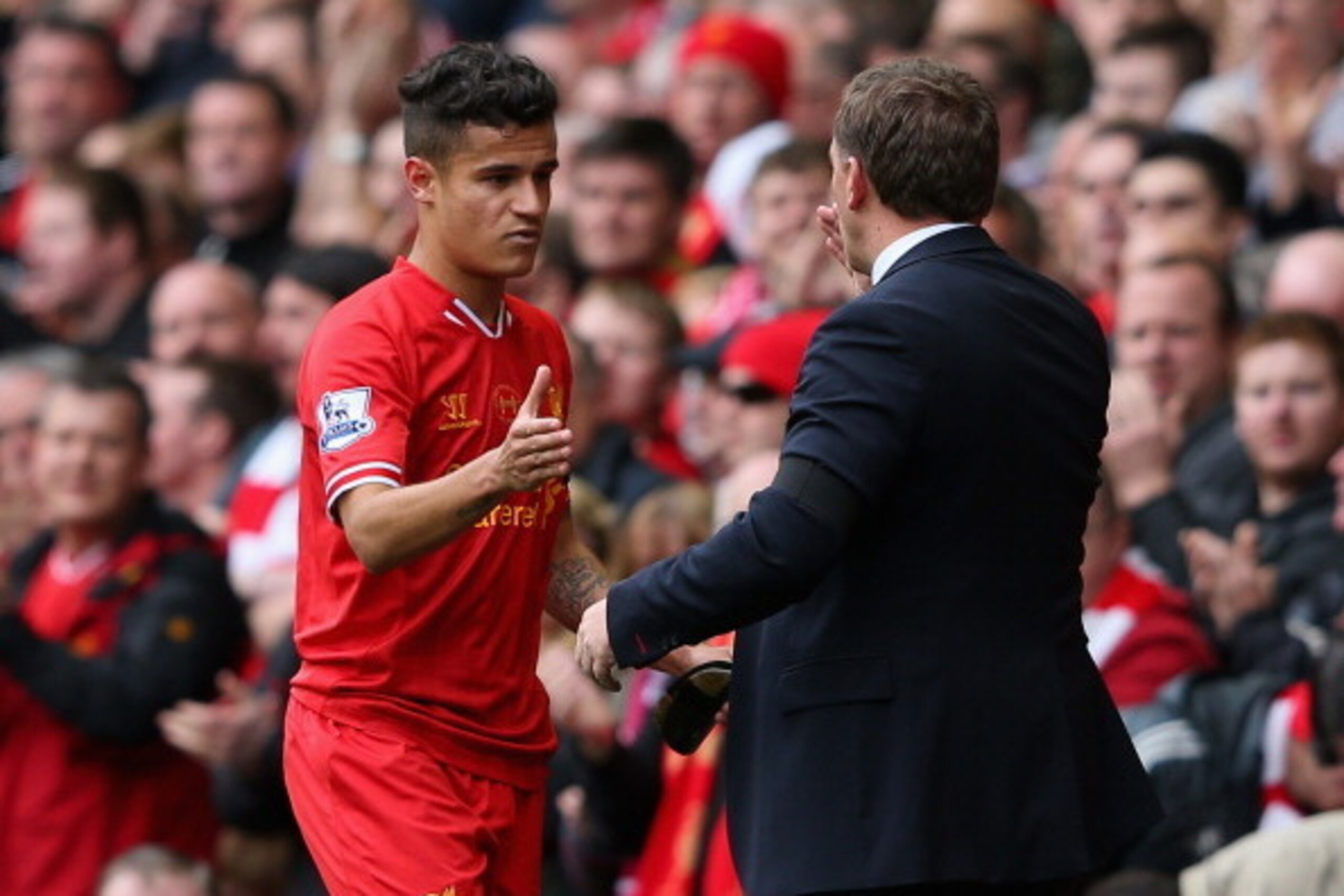 LIVERPOOL, ENGLAND - APRIL 13:  Liverpool Manager Brendan Rodgers congratulates Philippe Coutinho as he is substituted during the Barclays Premier League match between Liverpool and Manchester City at Anfield on April 13, 2014 in Liverpool, England.  (Pho