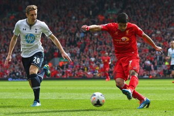 LIVERPOOL, ENGLAND - MARCH 30:  Luis Suarez of Liverpool scores the second goal during the Barclays Premier League match between Liverpool and Tottenham Hotspur at Anfield on March 30, 2014 in Liverpool, England.  (Photo by Alex Livesey/Getty Images)
