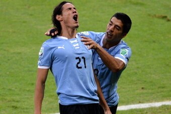 BELO HORIZONTE, BRAZIL - JUNE 26:  Edinson Cavani of Uruguay celebrates scoring his team's first goal to make the score 1-1 with team-mate Luis Suarez (R) during the FIFA Confederations Cup Brazil 2013 Semi Final match between Brazil and Uruguay at Govern