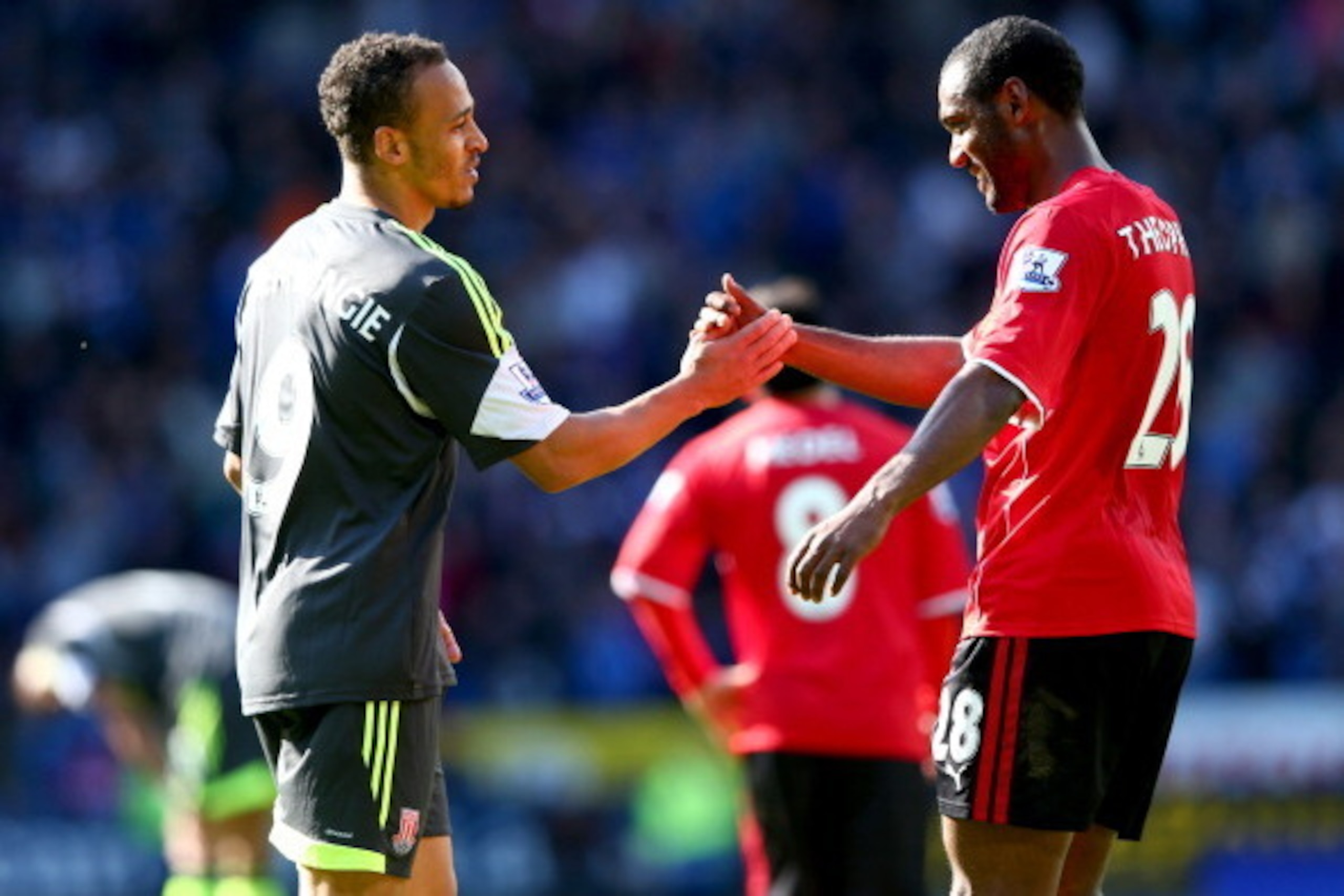 CARDIFF, WALES - APRIL 19:  Peter Odemwingie of Stoke City shakes hands with Kevin Theophile-Catherine of Cardiff City after the Barclays Premier League match between Cardiff City and Stoke City at Cardiff City Stadium on April 19, 2014 in Cardiff, Wales.