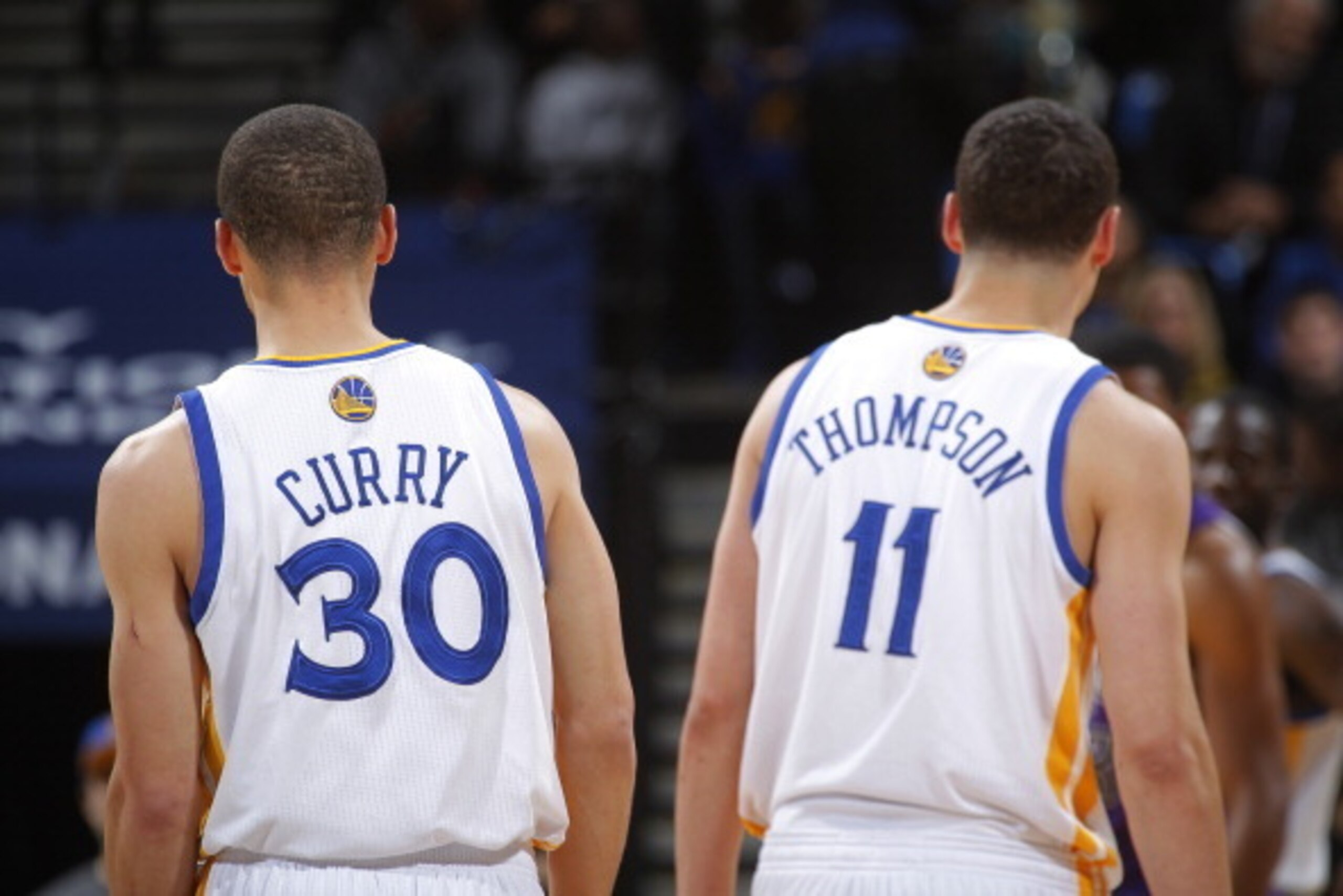 OAKLAND, CA - APRIL 4: Stephen Curry #30 and Klay Thompson #11 of the Golden State Warriors in a game against the Sacramento Kings on April 4, 2014 at Oracle Arena in Oakland, California. NOTE TO USER: User expressly acknowledges and agrees that, by downl