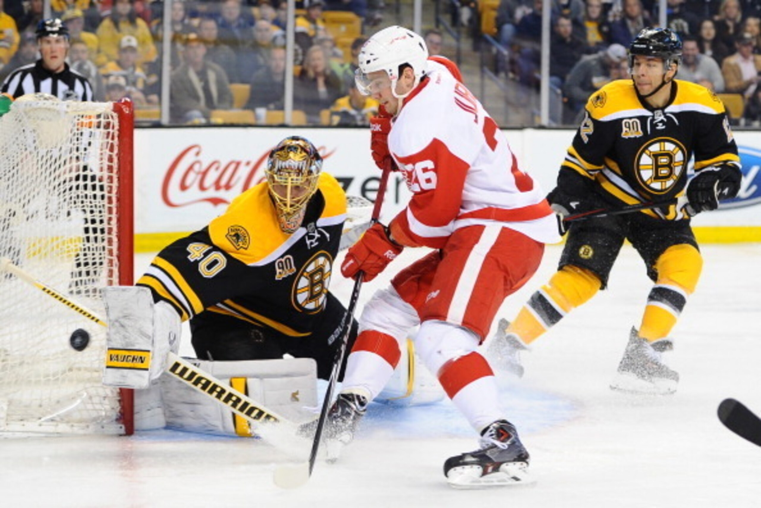 BOSTON, MA - APRIL 18: Tuukka Rask #40 of the Boston Bruins deflects the puck against Tomas Jurco #26 of the Detroit Red Wings in Game One of the First Round of the 2014 Stanley Cup Playoffs at TD Garden on April 18, 2014 in Boston, Massachusetts. (Photo 