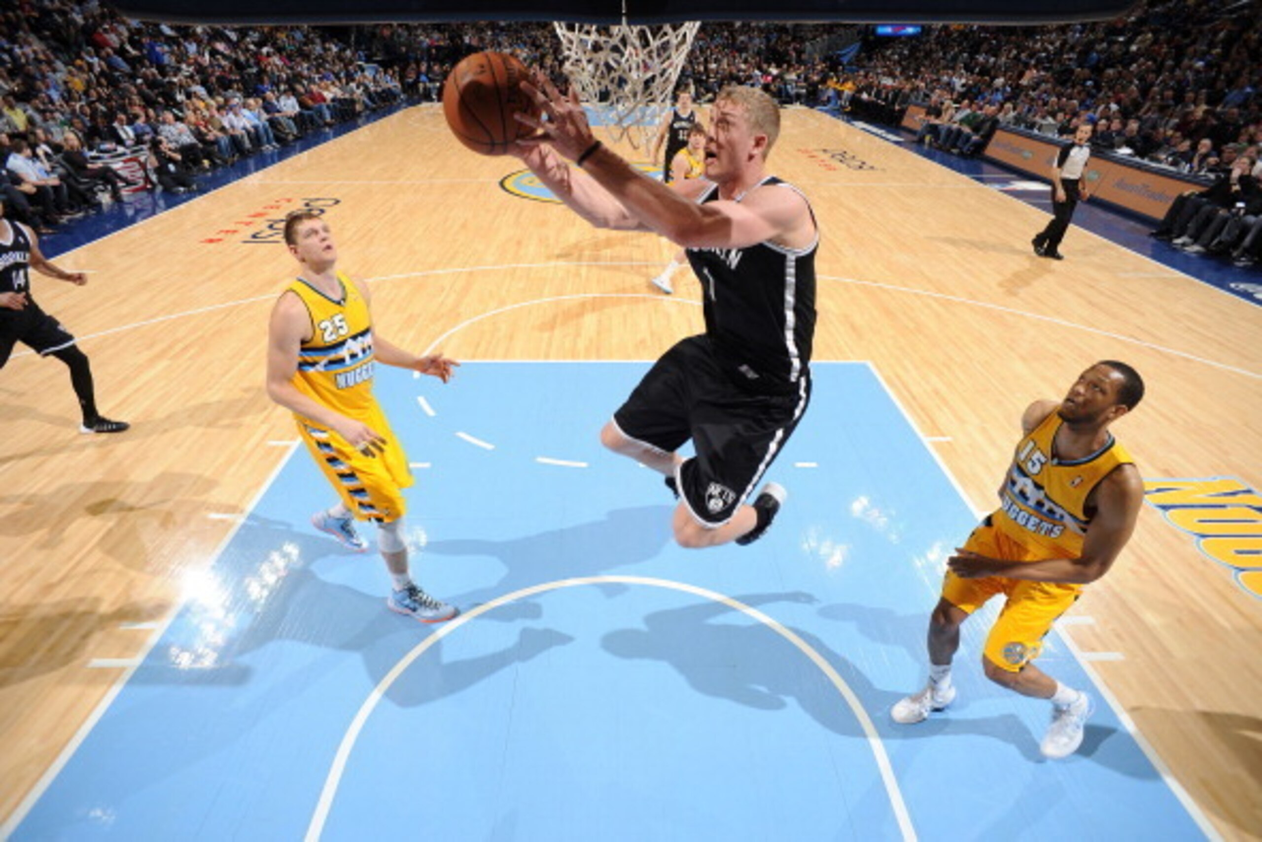 DENVER, CO - FEBRUARY 27: Mason Plumlee #1 of the Brooklyn Nets goes up for a shot during a game against the Denver Nuggets on February 27, 2014 at the Pepsi Center in Denver, Colorado. NOTE TO USER: User expressly acknowledges and agrees that, by downloa