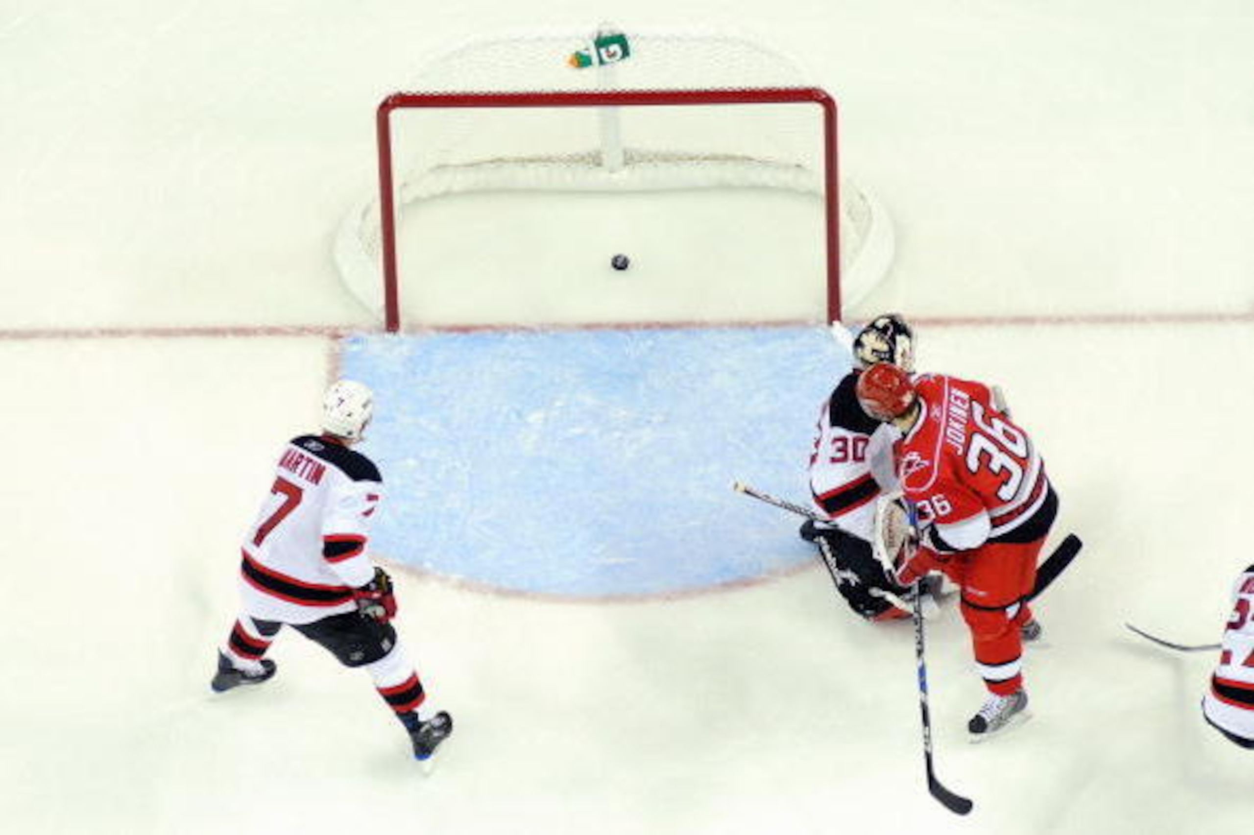 RALEIGH, NC - APRIL 21:  Jussi Jokinen #36 of the Carolina Hurricanes makes a goal against goalie Martin Brodeur #30 the New Jersey Devils during Game Four of the Eastern Conference Quarterfinals of the 2009 Stanley Cup Playoffs on April 21, 2009 at the R