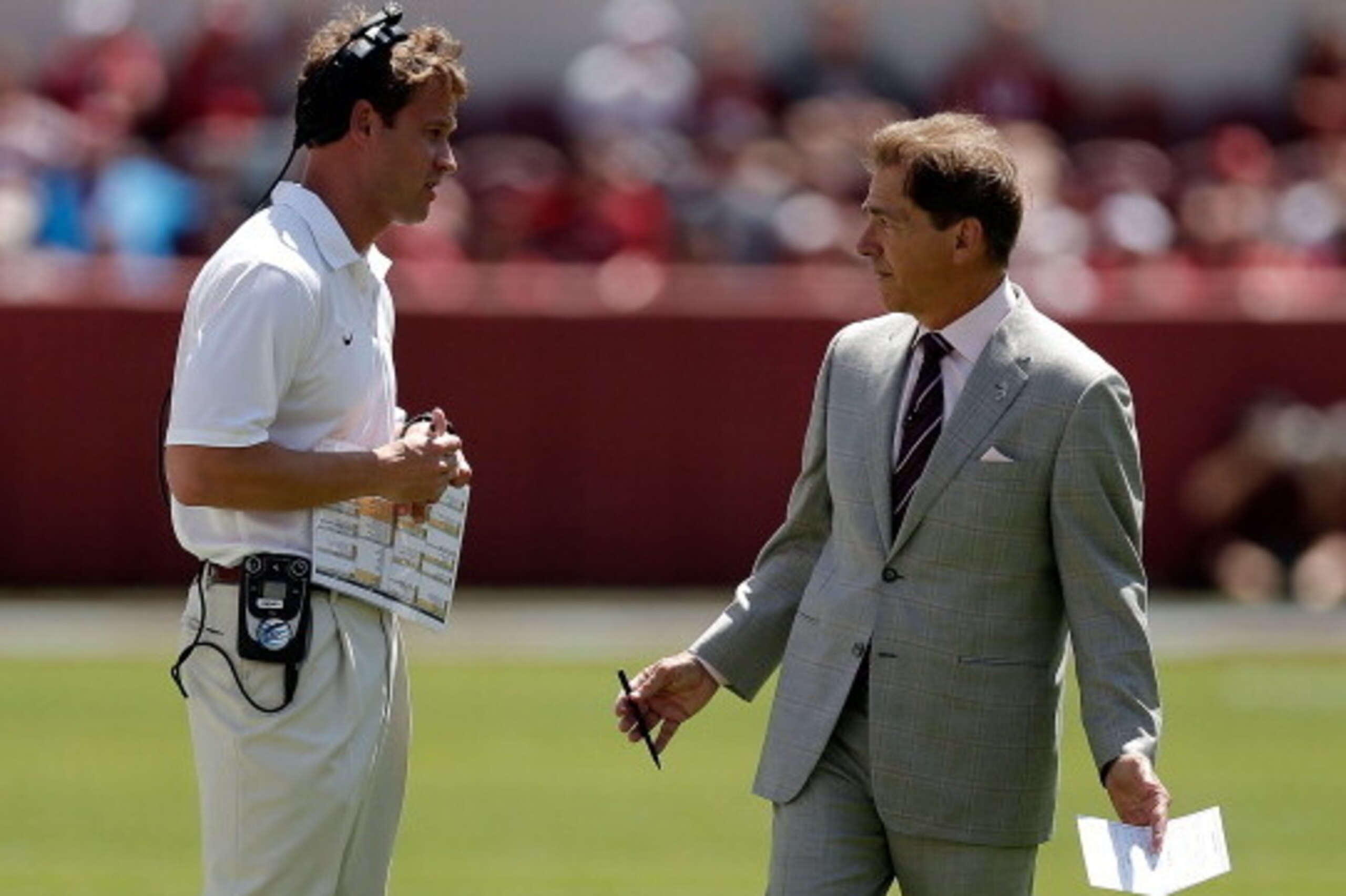 TUSCALOOSA, AL - APRIL 19:  Head coach Nick Saban of the Alabama Crimson Tide speaks with offensive coordinator Lane Kiffin during the Alabama A-Day spring game at Bryant-Denny Stadium on April 19, 2014 in Tuscaloosa, Alabama.  (Photo by Stacy Revere/Gett