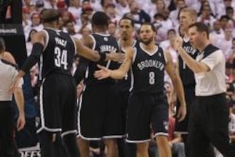 Apr 19, 2014; Toronto, Ontario, CAN; Brooklyn Nets guard Deron Williams (8) celebrates a basket with forward Paul Pierce (34) against the Toronto Raptors in game one during the first round of the 2014 NBA Playoffs at Air Canada Centre. The Nets beat the R