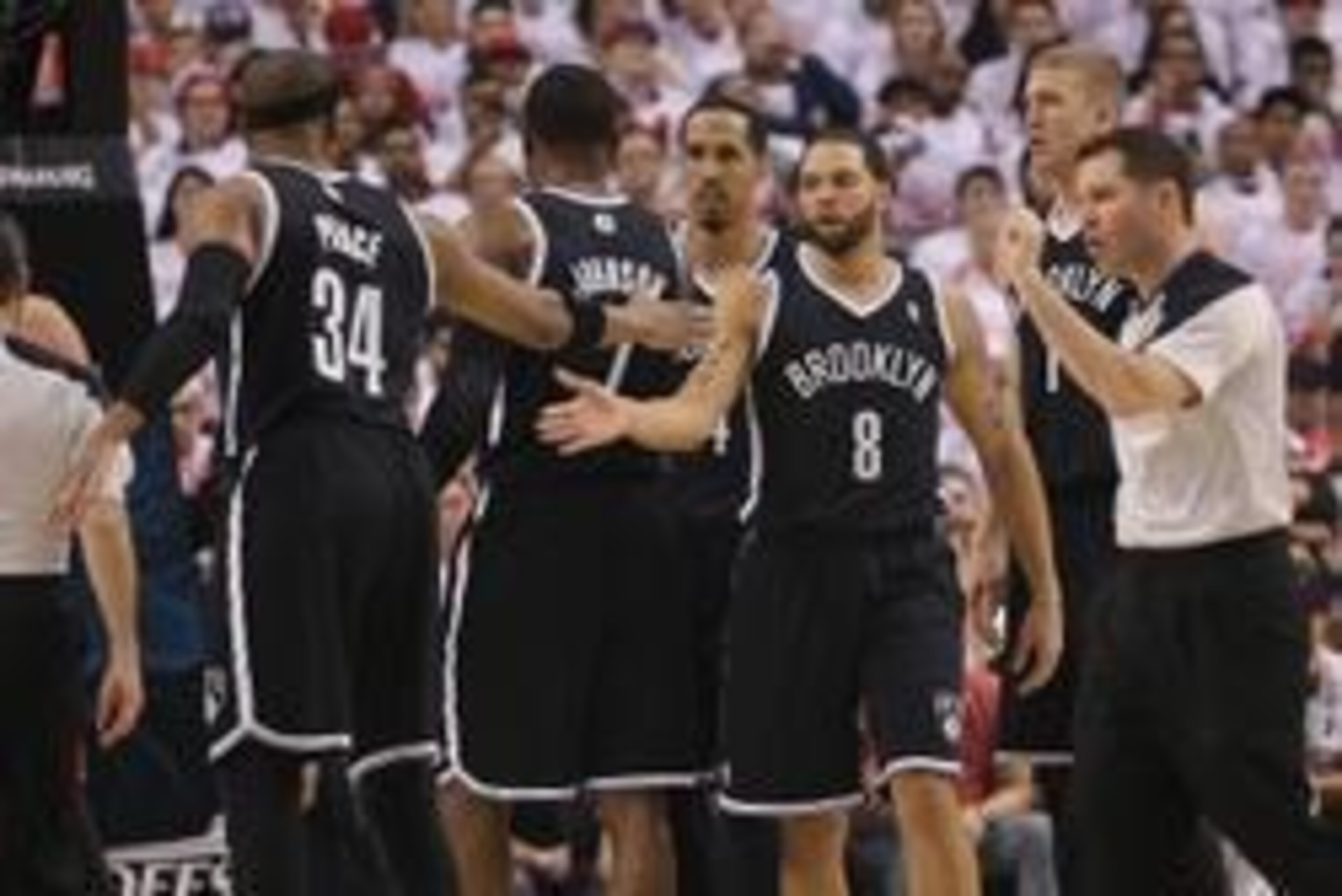 Apr 19, 2014; Toronto, Ontario, CAN; Brooklyn Nets guard Deron Williams (8) celebrates a basket with forward Paul Pierce (34) against the Toronto Raptors in game one during the first round of the 2014 NBA Playoffs at Air Canada Centre. The Nets beat the R Apr 19, 2014; Toronto, Ontario, CAN; Brooklyn Nets guard Deron Williams (8) celebrates a basket with forward Paul Pierce (34) against the Toronto Raptors in game one during the first round of the 2014 NBA Playoffs at Air Canada Centre. The Nets beat the R