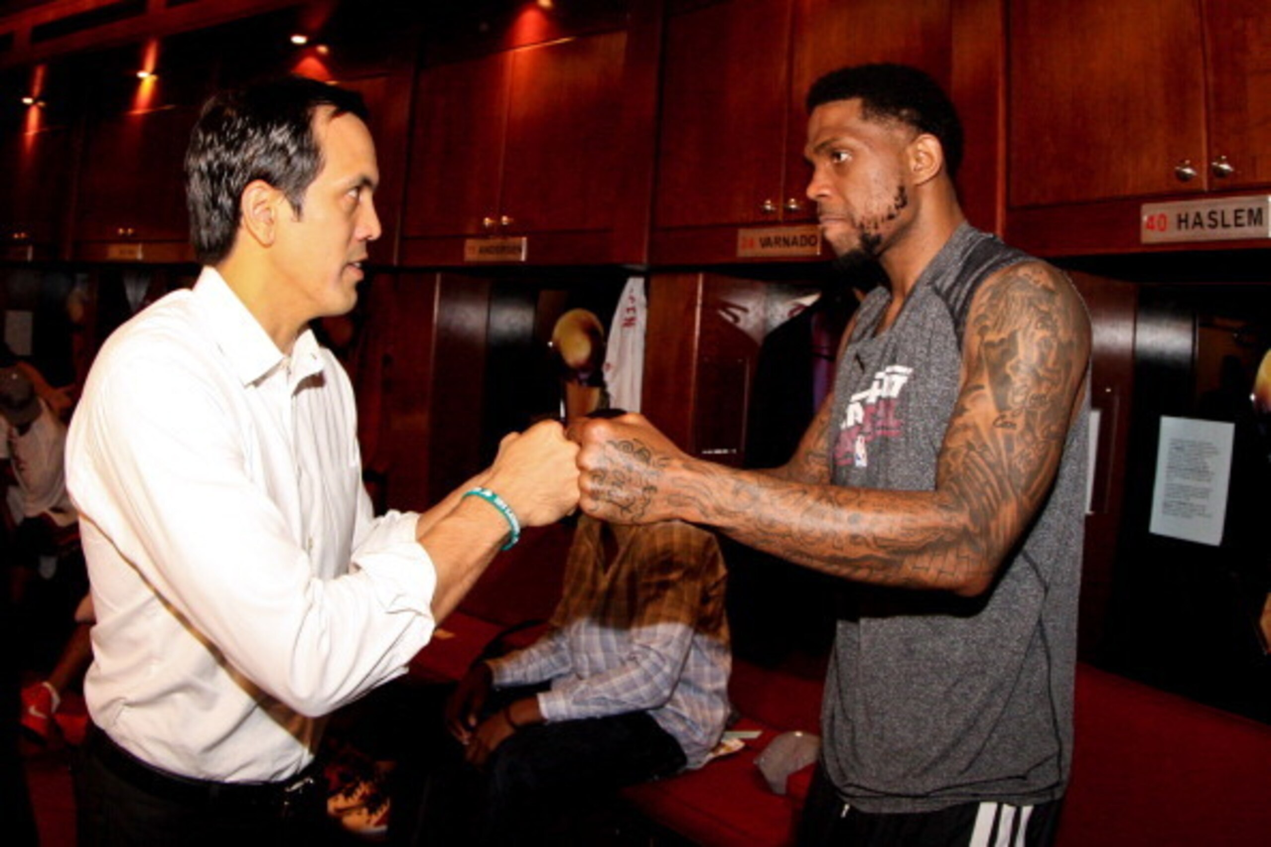 MIAMI, FL - JUNE 3: Head Coach Erik Spoelstra of the Miami Heat celebrates with Udonis Haslem #40 in the locker room following their team's series victory against the Indiana Pacers in Game Seven of the Eastern Conference Finals during the 2013 NBA Playof