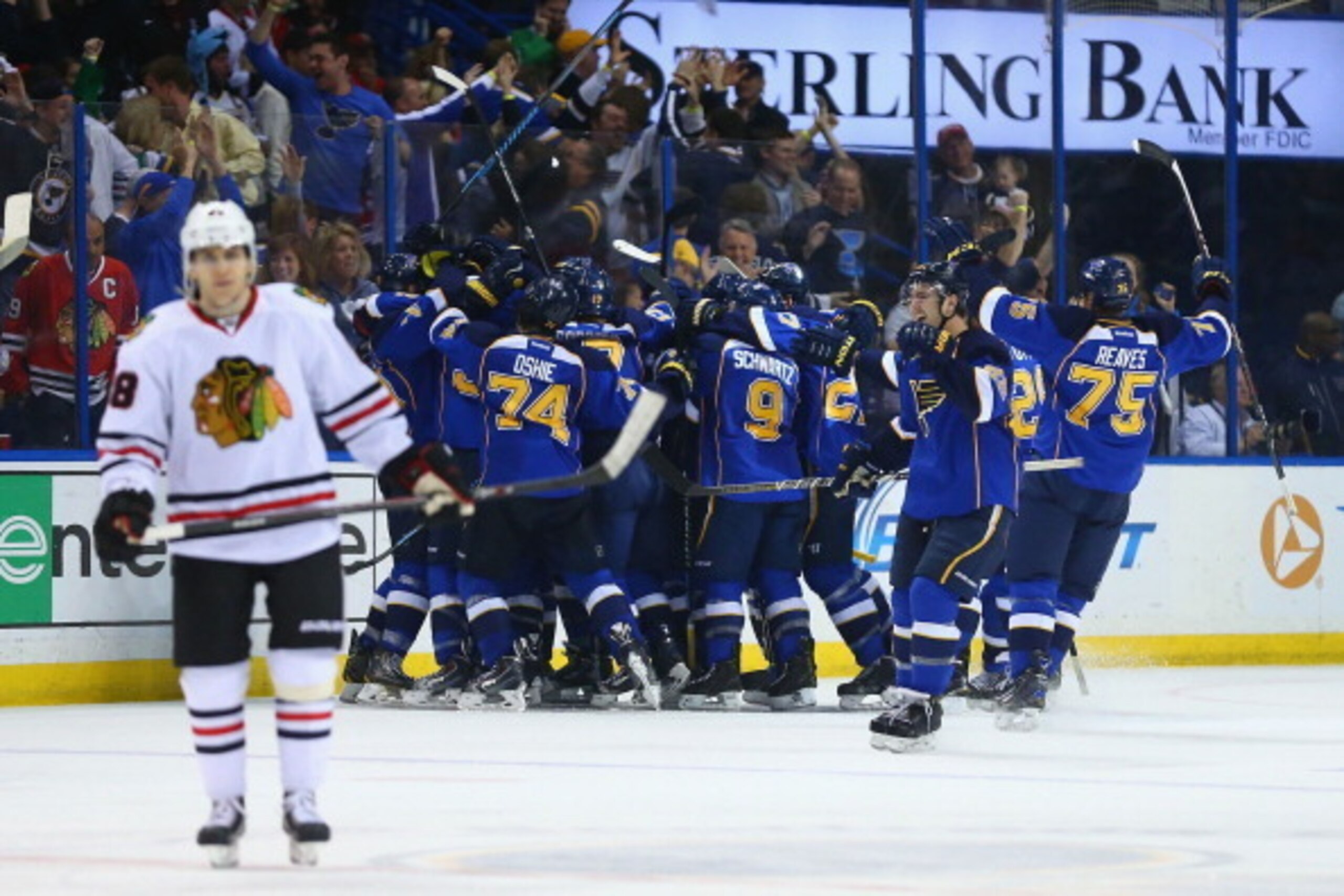 ST. LOUIS, MO - APRIL 19: Members of the St. Louis Blues celebrate after beating the Chicago Blackhawks in overtime in Game Two of the First Round of the 2014 Stanley Cup Playoffs at the Scottrade Center on April 19, 2014 in St. Louis, Missouri. The Blue ST. LOUIS, MO - APRIL 19: Members of the St. Louis Blues celebrate after beating the Chicago Blackhawks in overtime in Game Two of the First Round of the 2014 Stanley Cup Playoffs at the Scottrade Center on April 19, 2014 in St. Louis, Missouri. The Blue