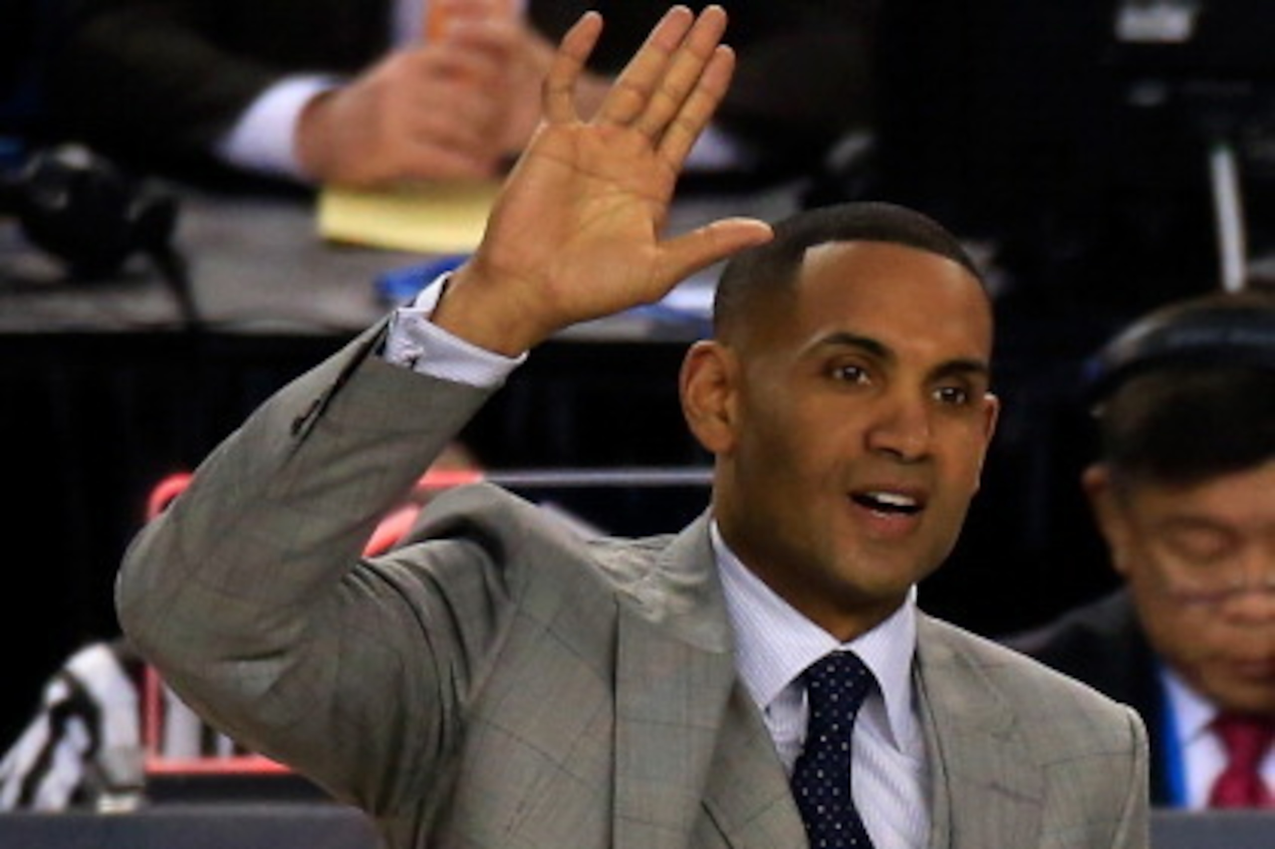 ARLINGTON, TX - APRIL 05: Former NBA player and broadcaster Grant Hill acknowledges the crowd during the NCAA Men's Final Four Semifinal between the Florida Gators and the Connecticut Huskies at AT&T Stadium on April 5, 2014 in Arlington, Texas.  (Photo b