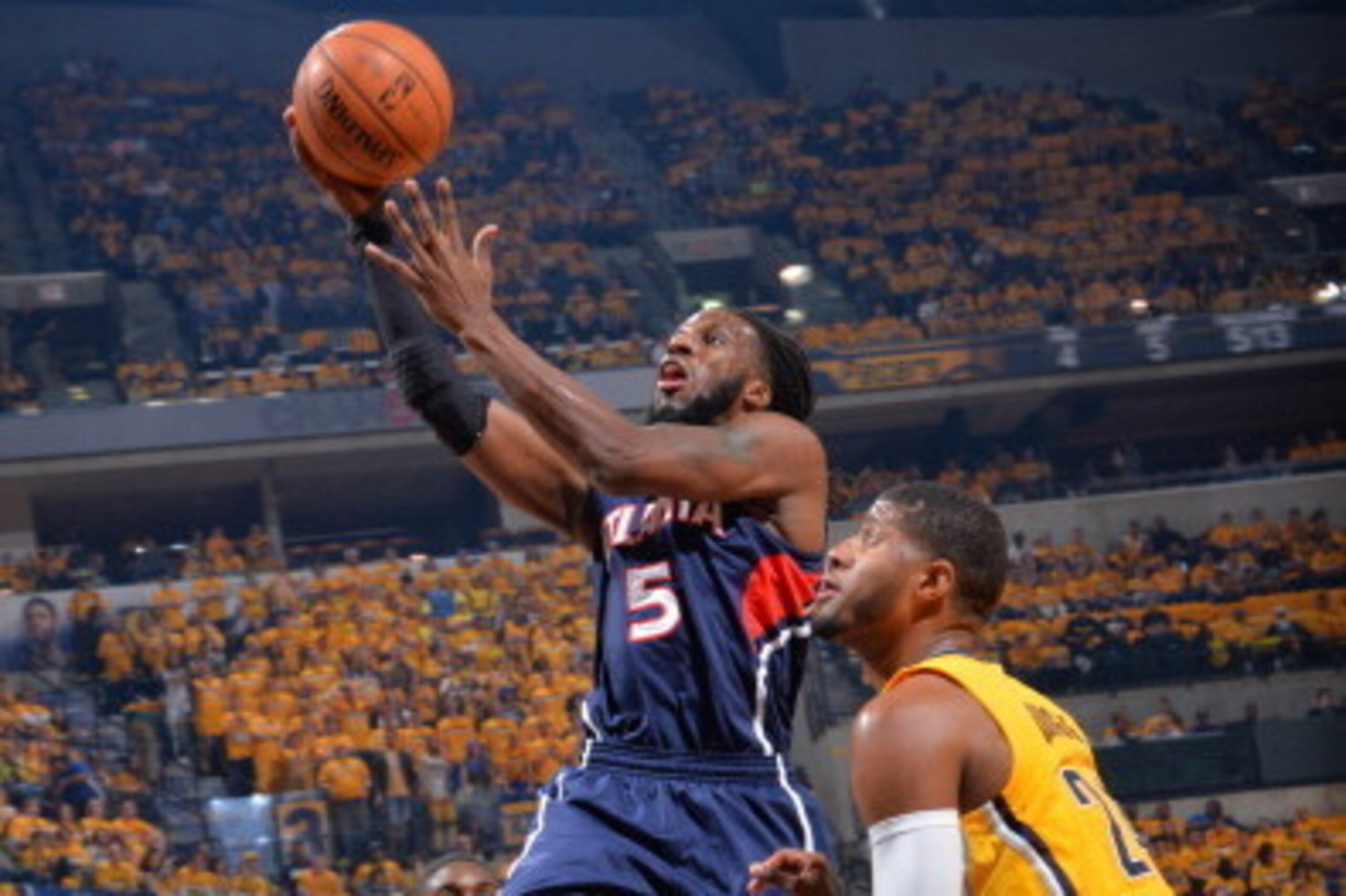 INDIANAPOLIS, IN - APRIL 19: DeMarre Carroll #5 of the Atlanta Hawks goes up for the layup against the Indiana Pacers in Game One of the Eastern Conference Quarterfinals during the 2014 NBA Playoffs on April 19, 2014 at Bankers Life Fieldhouse in Indianap