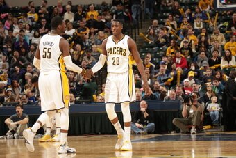 INDIANAPOLIS - MARCH 2: Roy Hibbert #55 and Ian Mahinmi #28 of the Indiana Pacers celebrate in a game against the Utah Jazz at Bankers Life Fieldhouse on March 2, 2014 in Indianapolis, Indiana.  NOTE TO USER: User expressly acknowledges and agrees that, b