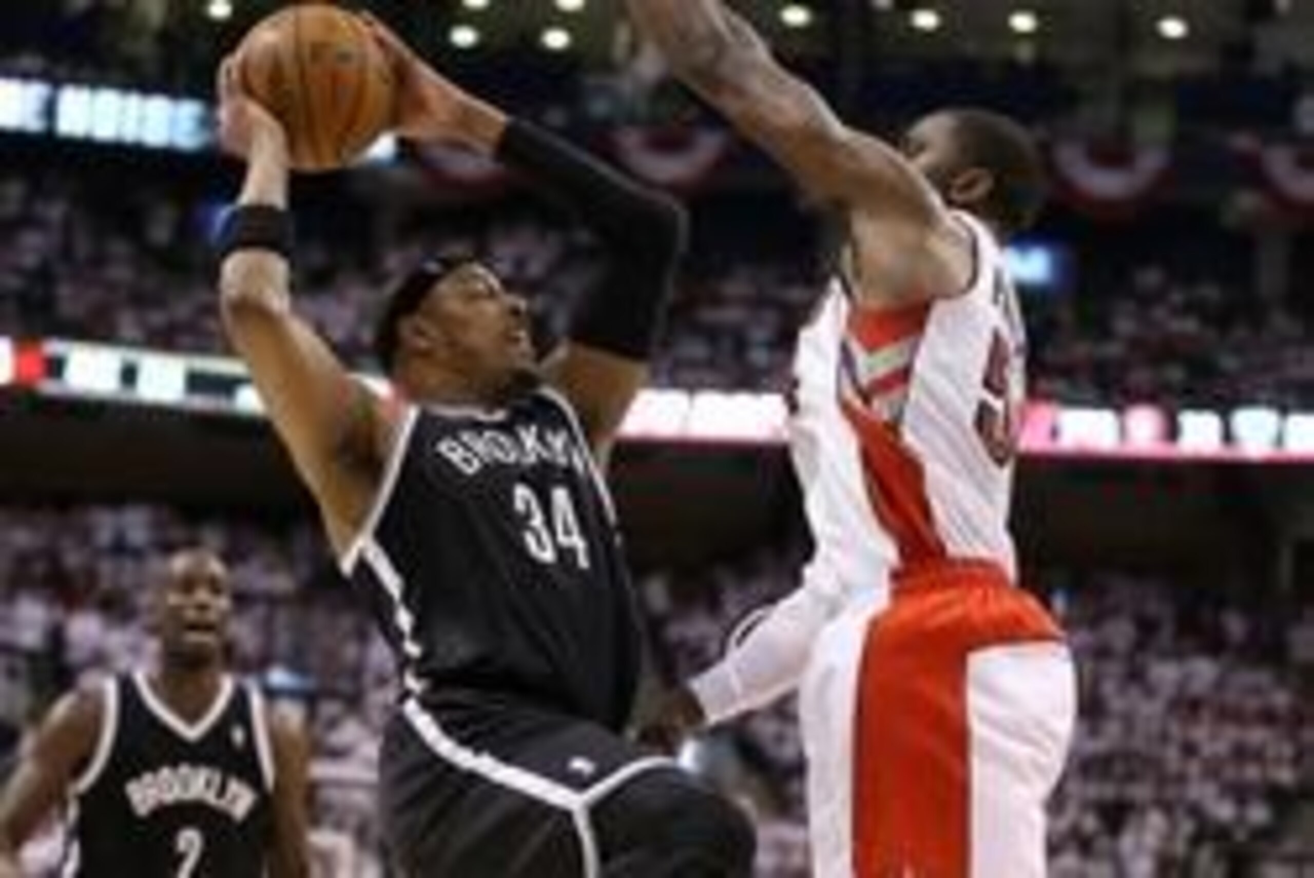 Apr 19, 2014; Toronto, Ontario, CAN; Brooklyn Nets forward Paul Pierce (34) makes a move to the basket as Toronto Raptors forward Patrick Patterson (54) defends in game one during the first round of the 2014 NBA Playoffs at Air Canada Centre. The Nets bea