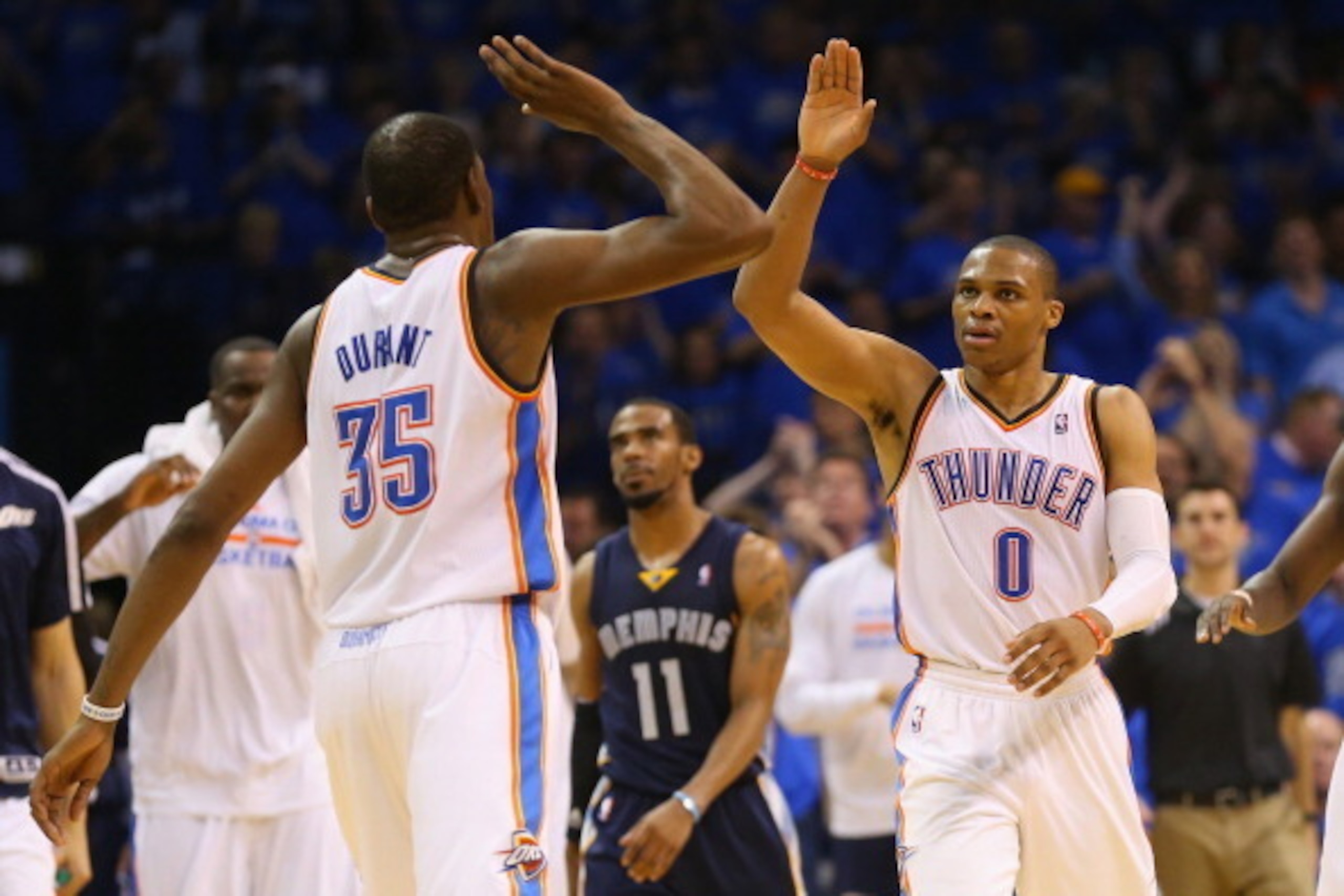 OKLAHOMA CITY, OK - APRIL 19:  Kevin Durant #35 of the Oklahoma City Thunder and Russell Westbrook #0 of the Oklahoma City Thunder celebrate against the Memphis Grizzlies in Game One of the Western Conference Quarterfinals during the 2014 NBA Playoffs at 