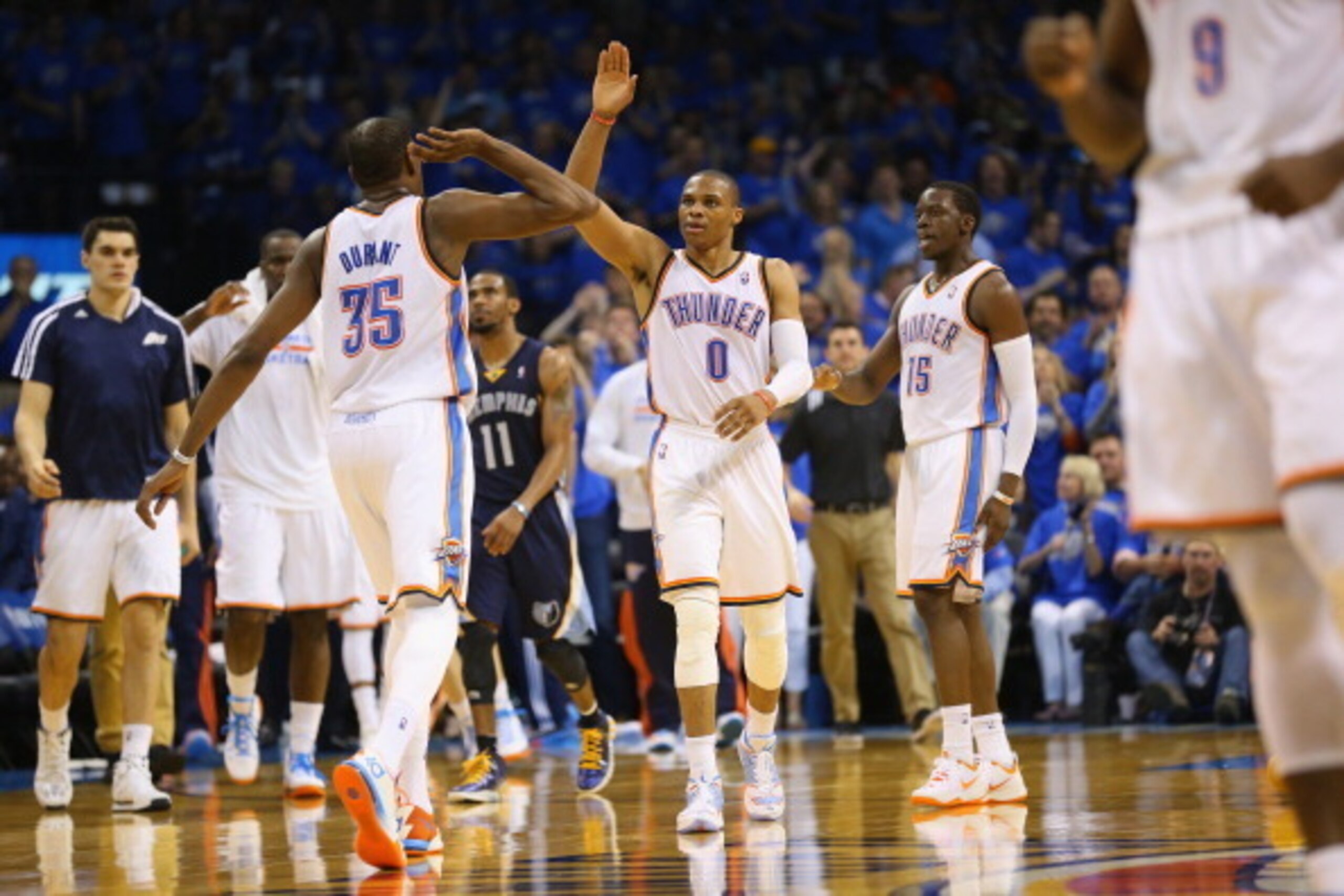OKLAHOMA CITY, OK - APRIL 19:  Kevin Durant #35 of the Oklahoma City Thunder and Russell Westbrook #0 of the Oklahoma City Thunder celebrate against the Memphis Grizzlies in Game One of the Western Conference Quarterfinals during the 2014 NBA Playoffs at 