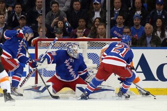 NEW YORK, NY - APRIL 17:  Henrik Lundqvist #30 of the New York Rangers tends net against the Philadelphia Flyers in Game One of the First Round of the 2014 NHL Stanley Cup Playoffs at Madison Square Garden on April 17, 2014 in New York City. The Rangers d