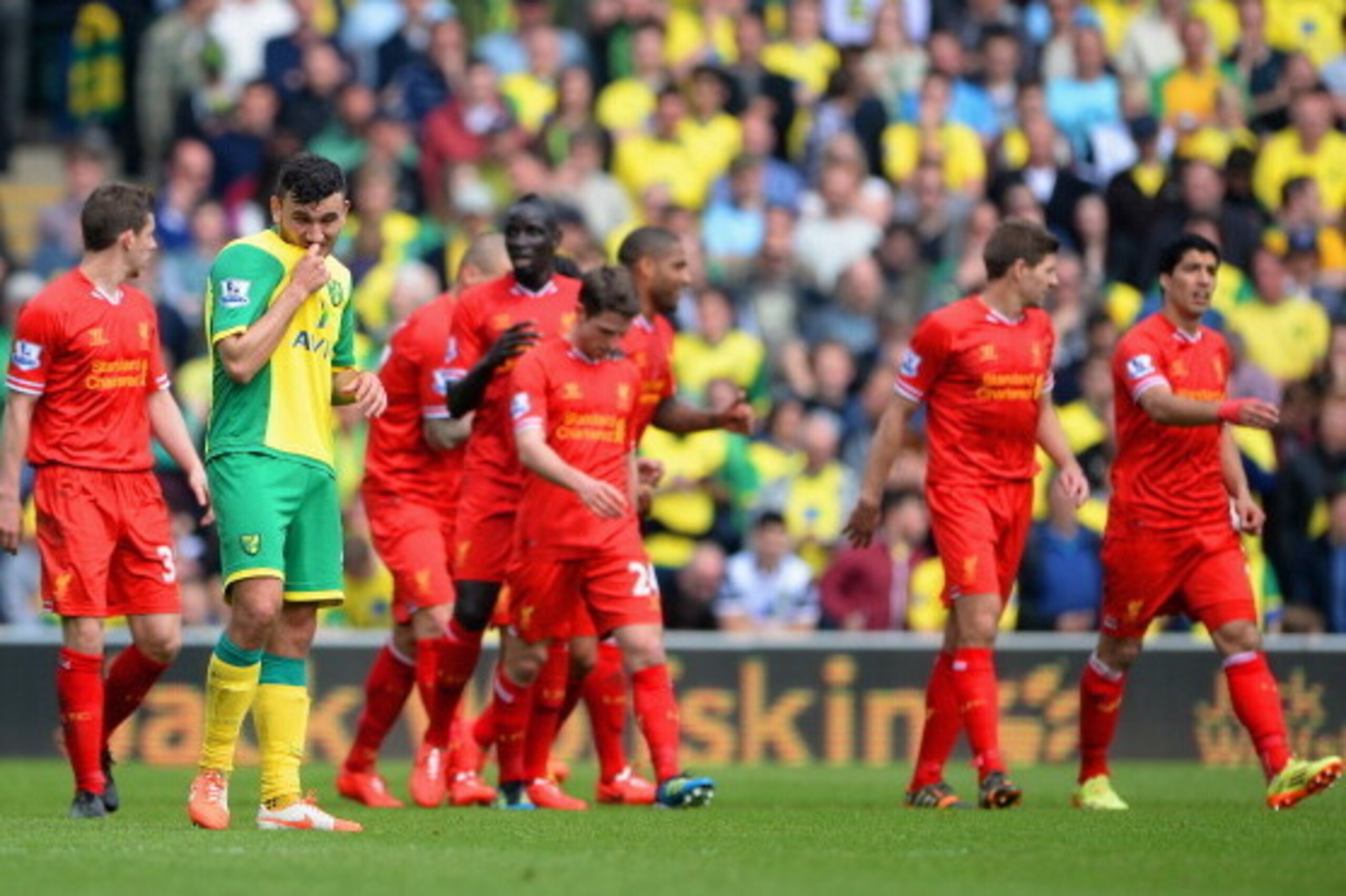 NORWICH, ENGLAND - APRIL 20: A dejected Robert Snodgrass of Norwich City looks on after the third Liverpool goal during the Barclays Premier League match between Norwich City and Liverpool at Carrow Road on April 20, 2014 in Norwich, England.  (Photo by M