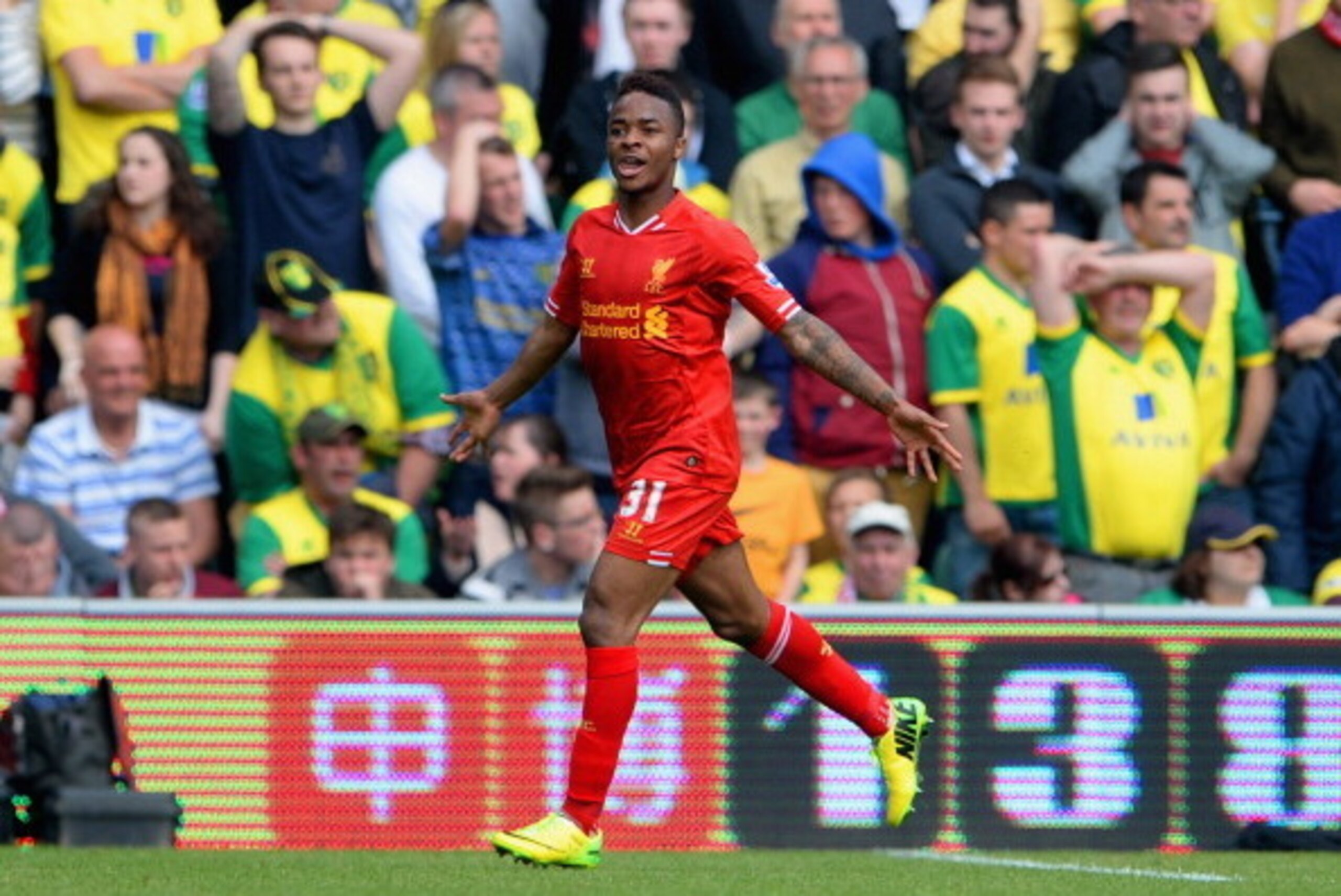 NORWICH, ENGLAND - APRIL 20:  Raheem Sterling of Liverpool celebrates scoring their third goal during the Barclays Premier League match between Norwich City and Liverpool at Carrow Road on April 20, 2014 in Norwich, England.  (Photo by Michael Regan/Getty