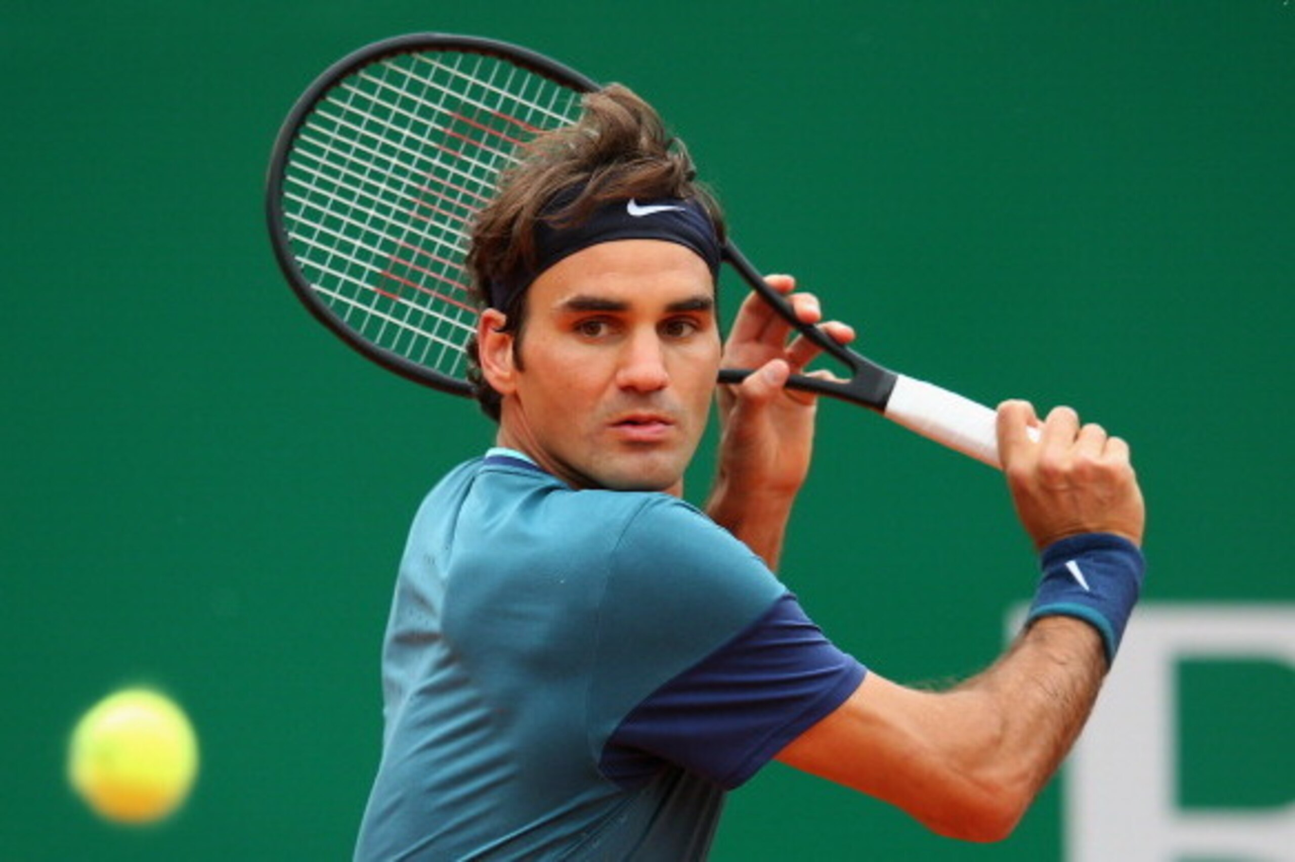 MONTE-CARLO, MONACO - APRIL 20:  Roger Federer of Switzerland in action against Stanislas Wawrinka of Switzerland in the final during day eight of the ATP Monte Carlo Rolex Masters Tennis at Monte-Carlo Sporting Club on April 20, 2014 in Monte-Carlo, Mona