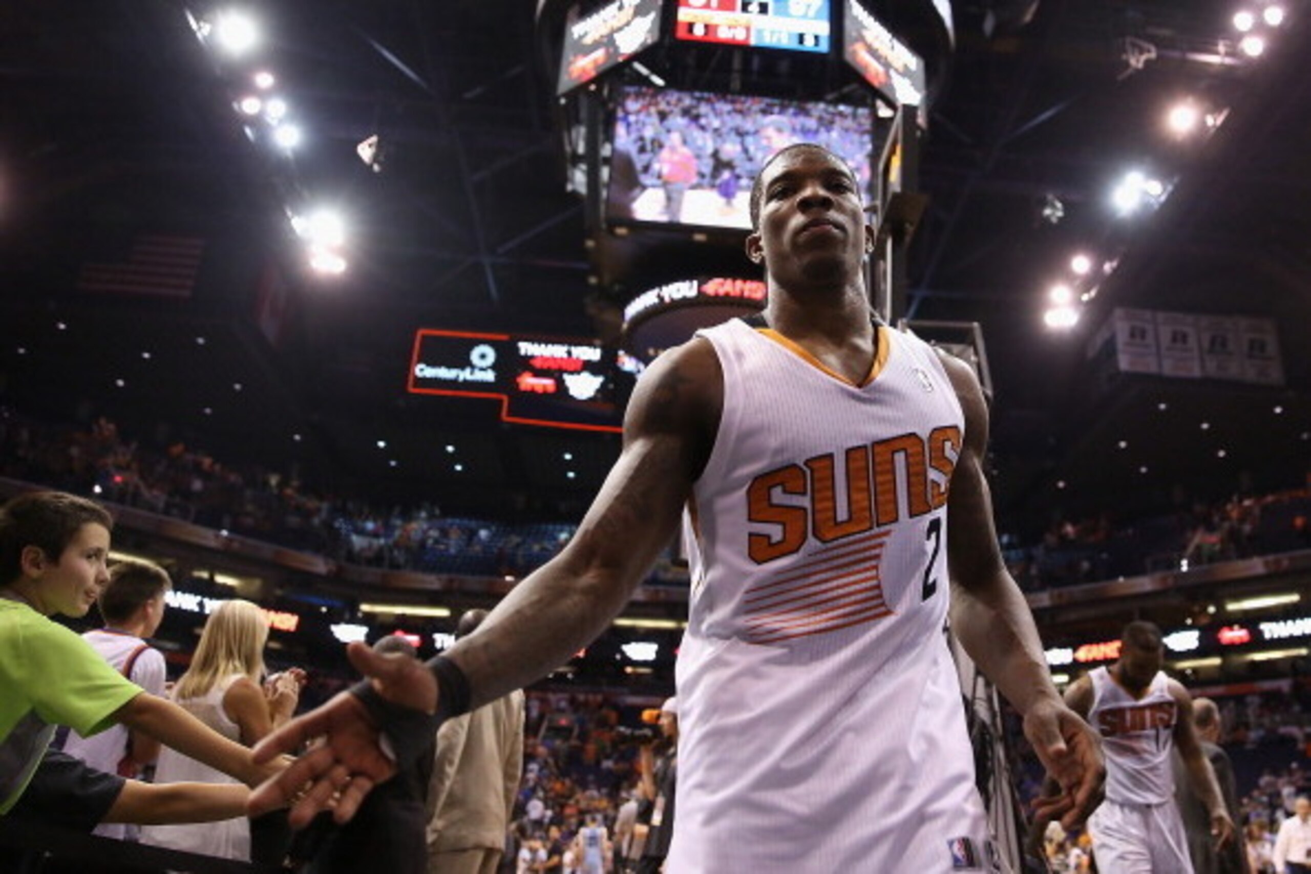 PHOENIX, AZ - APRIL 14:  Eric Bledsoe #2 of the Phoenix Suns high fives fans as he walks off the court following the NBA game against the Memphis Grizzlies at US Airways Center on April 14, 2014 in Phoenix, Arizona.  The Grizzlies defeated the Suns 97-91.