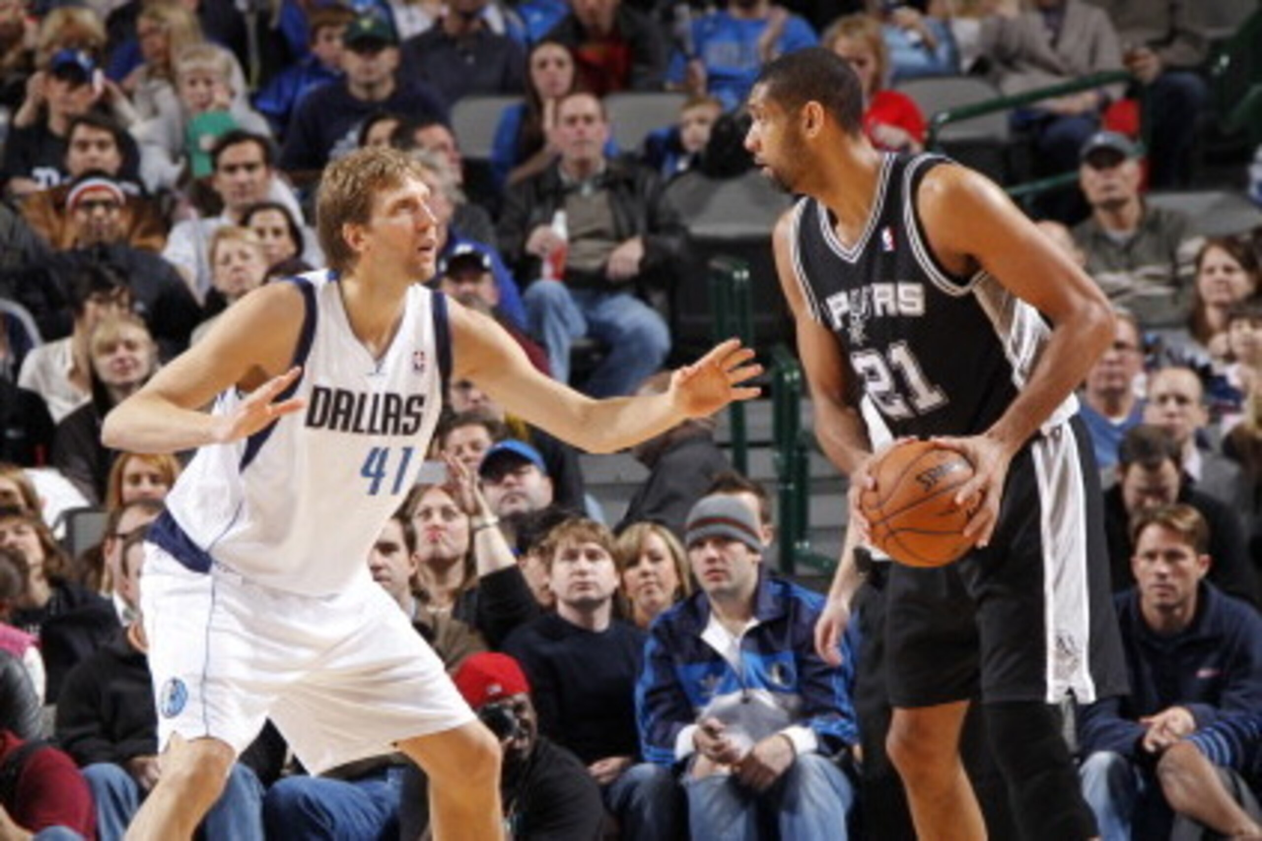 DALLAS, TX - DECEMBER 30:  Tim Duncan #21 of the San Antonio Spurs looks to drive against Dirk Nowitzki #41 of the Dallas Mavericks on December 30, 2012 at the American Airlines Center in Dallas, Texas. NOTE TO USER: User expressly acknowledges and agrees