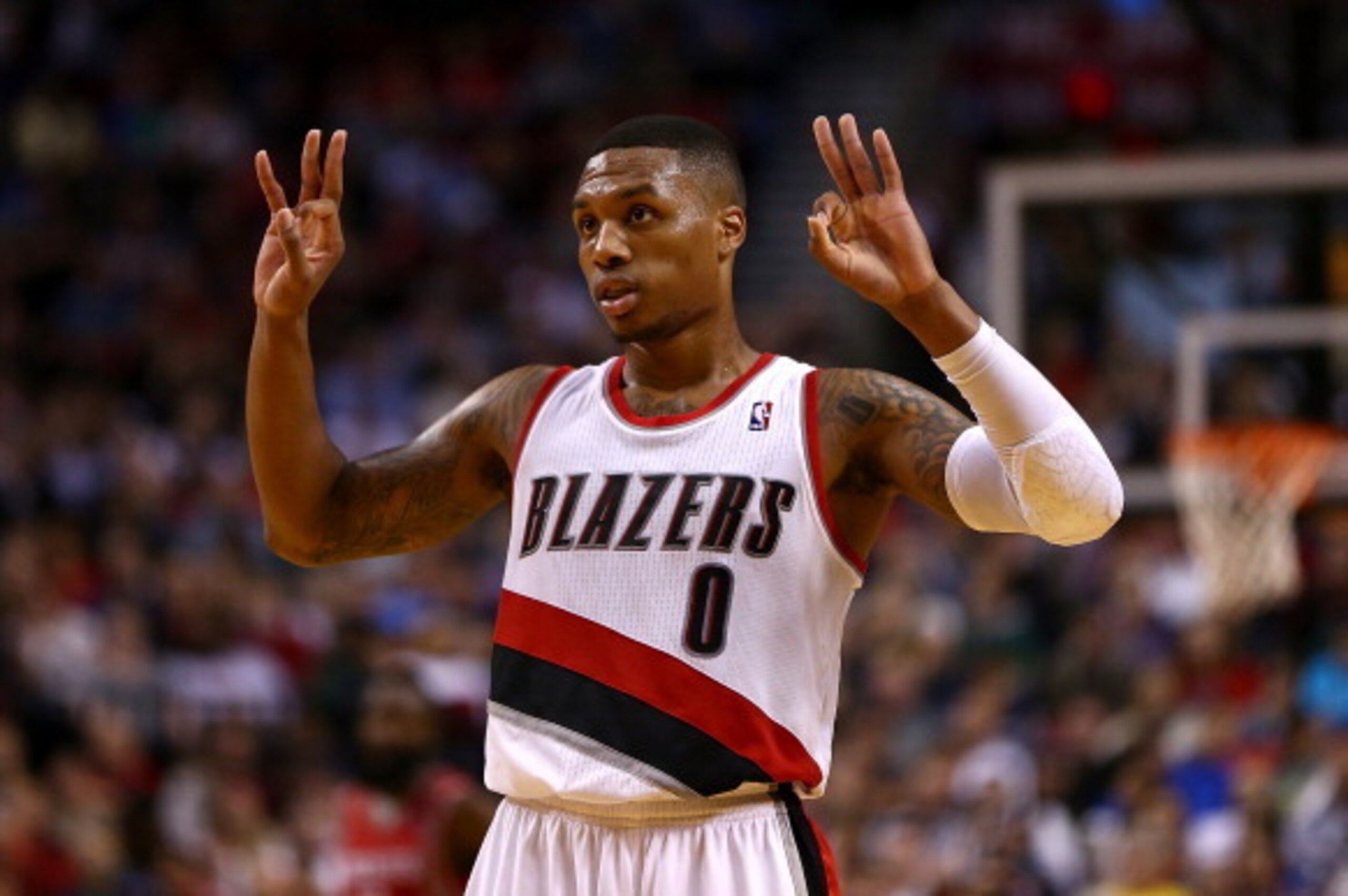 PORTLAND, OR - NOVEMBER 05:  Damian Lillard #0 of the Portland Trail Blazers calls a play against the Houston Rockets on November 5, 2013 at the Moda Center in Portland, Oregon.  NOTE TO USER: User expressly acknowledges and agrees that, by downloading an