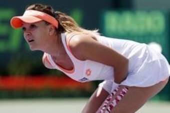 Mar 26, 2014; Miami, FL, USA; Agnieszka Radwanska watches a challenge replay on match point against Dominika Cibulkova (not pictured) on day ten of the Sony Open at Crandon Tennis Center. Mandatory Credit: Geoff Burke-USA TODAY Sports