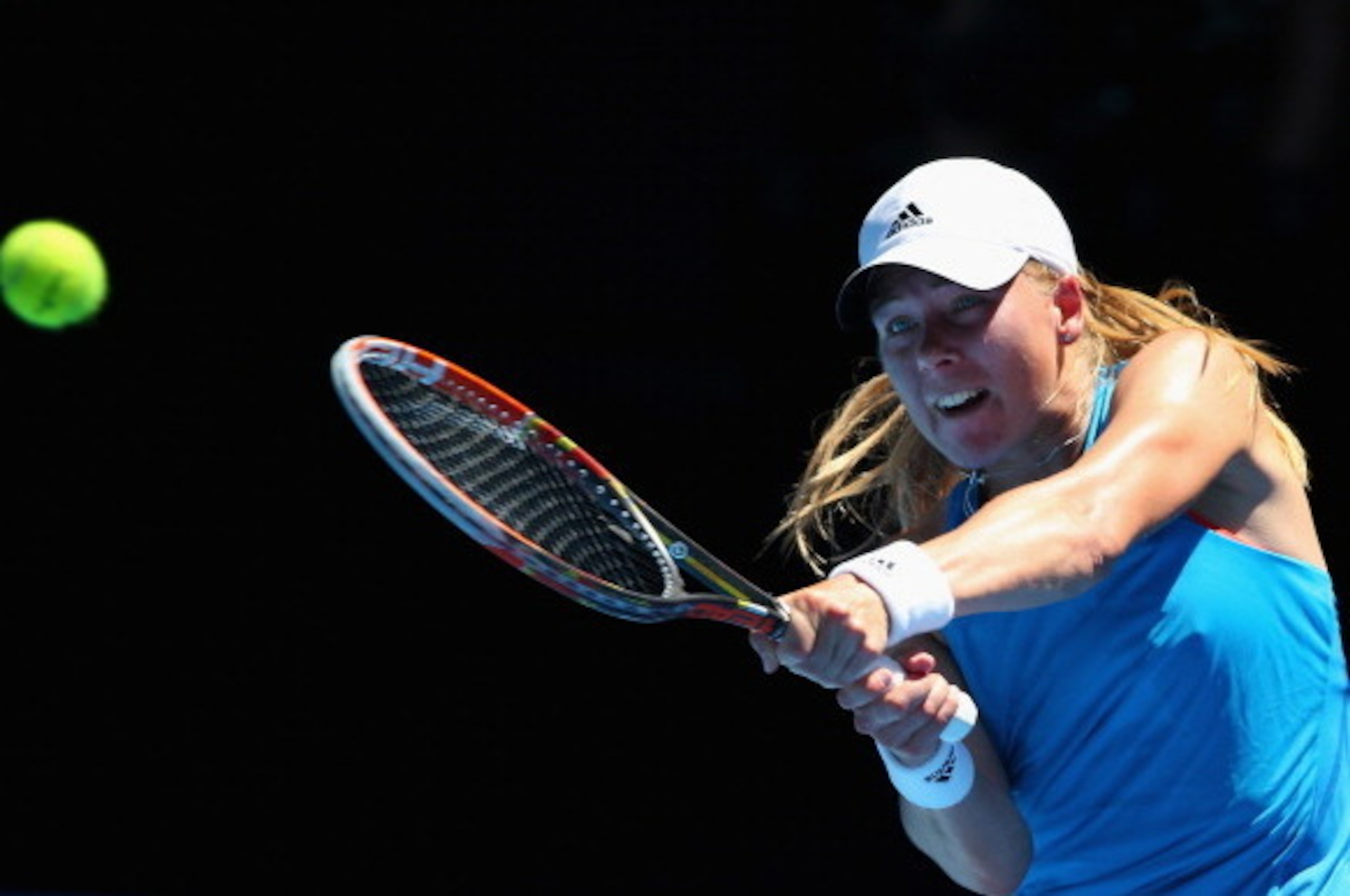 MELBOURNE, AUSTRALIA - JANUARY 14:  Johanna Larsson of Sweden plays a backhand in her first round match against Victoria Azarenka of Belarus during day two of the 2014 Australian Open at Melbourne Park on January 14, 2014 in Melbourne, Australia.  (Photo 