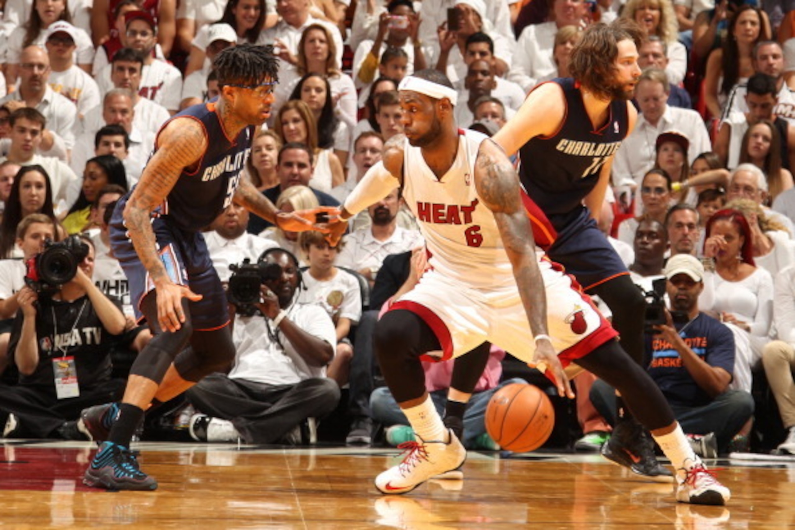 MIAMI, FL - April 20: LeBron James #6 of the Miami Heat handles the ball against the Charlotte Bobcats during Game One of the Eastern Conference Quarterfinals of the 2014 NBA playoffs at the American Airlines Arena in Miami, Florida on April 20, 2014. NOT