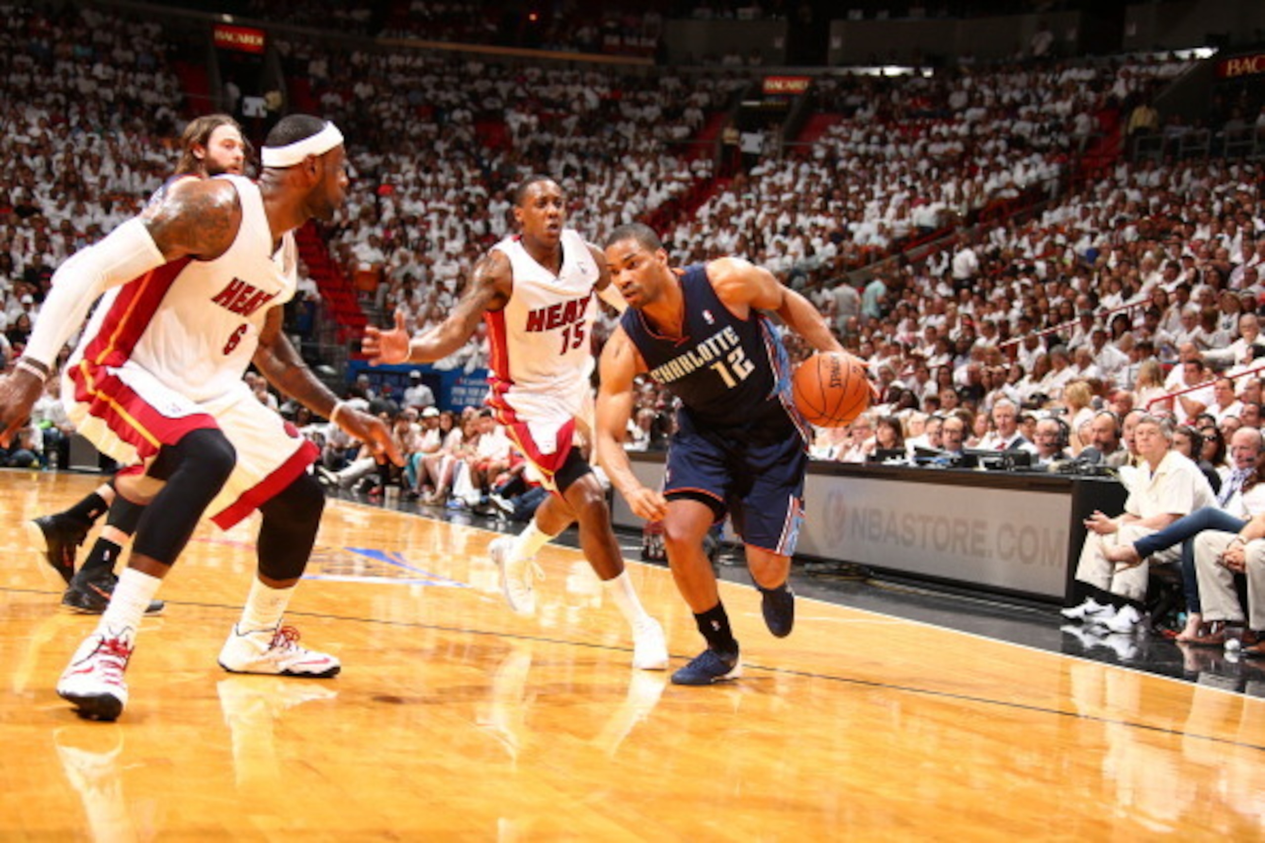 MIAMI, FL - April 20: Gary Neal #12 of the Charlotte Bobcats drives against the Miami Heat during Game One of the Eastern Conference Quarterfinals of the 2014 NBA playoffs at the American Airlines Arena in Miami, Florida on April 20, 2014. NOTE TO USER: U