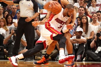 MIAMI, FL - April 20: Dwyane Wade #3 of the Miami Heat handles the ball against the Charlotte Bobcats during Game One of the Eastern Conference Quarterfinals of the 2014 NBA playoffs at the American Airlines Arena in Miami, Florida on April 20, 2014. NOTE