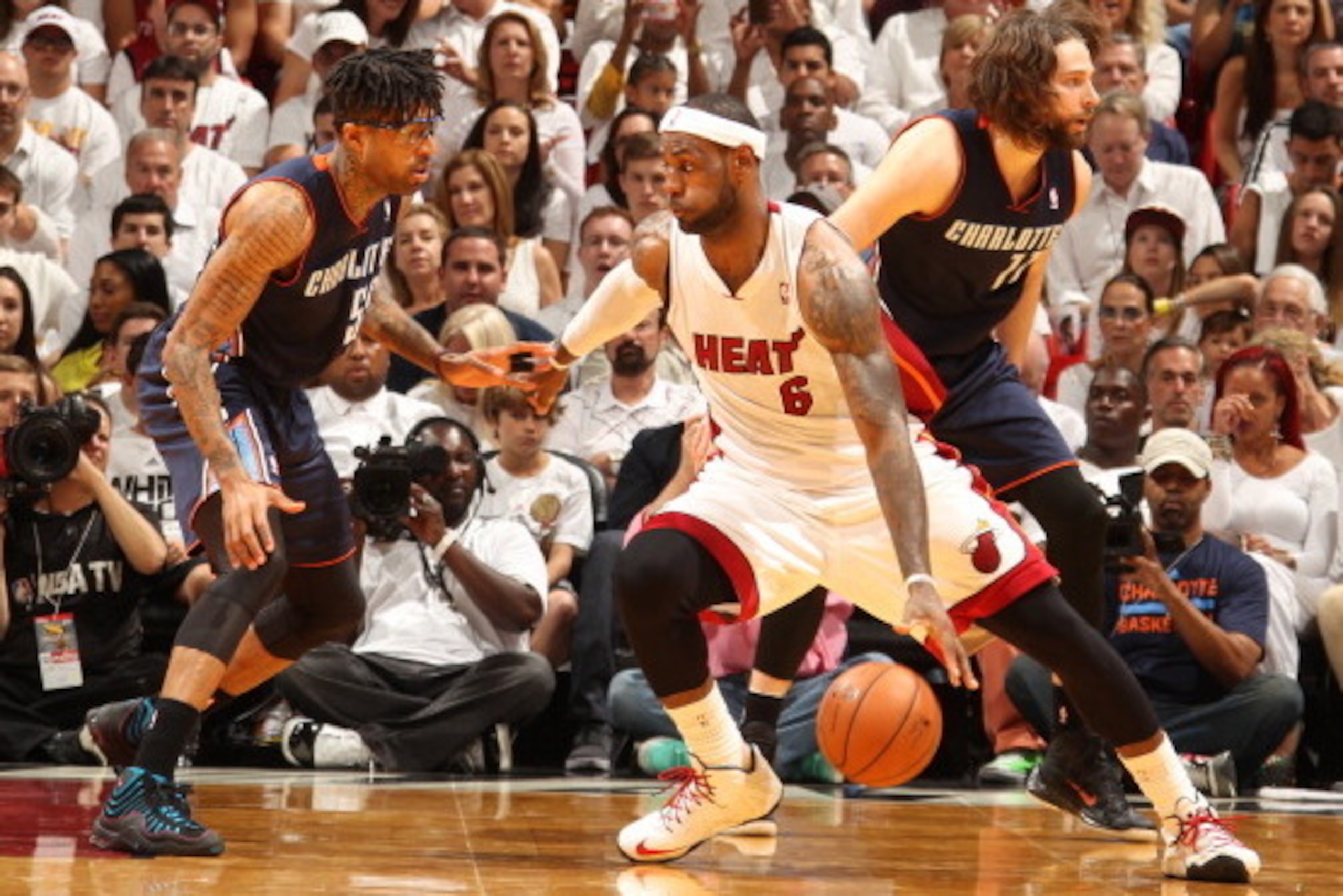 MIAMI, FL - April 20: LeBron James #6 of the Miami Heat handles the ball against the Charlotte Bobcats during Game One of the Eastern Conference Quarterfinals of the 2014 NBA playoffs at the American Airlines Arena in Miami, Florida on April 20, 2014. NOT