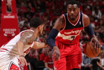 CHICAGO, IL APRIL 20: John Wall #2 of the Washington Wizards handles the ball against the Chicago Bulls during Game 1 of the Eastern Conference Quarterfinals on April 20, 2014 at the United Center in Chicago, Illinois. NOTE TO USER: User expressly acknow CHICAGO, IL APRIL 20: John Wall #2 of the Washington Wizards handles the ball against the Chicago Bulls during Game 1 of the Eastern Conference Quarterfinals on April 20, 2014 at the United Center in Chicago, Illinois. NOTE TO USER: User expressly acknow