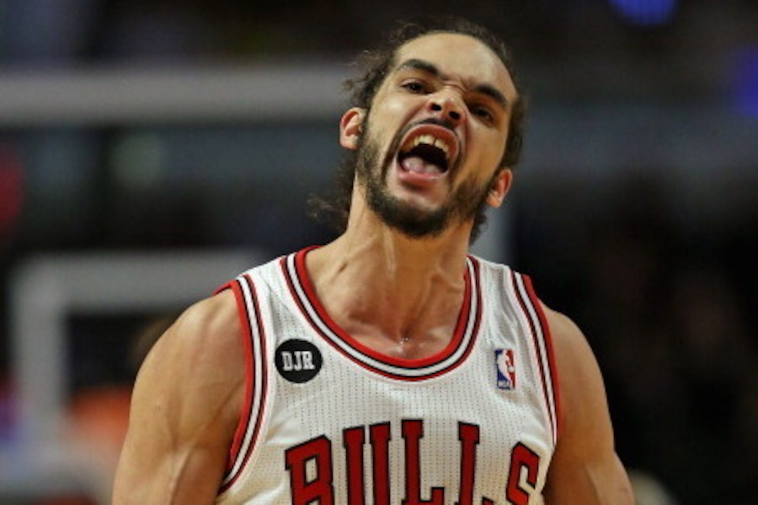 CHICAGO, IL - MARCH 24:  Joakim Noah #13 of the Chicago Bulls celebrates a play against the Indiana Pacers at the United Center on March 24, 2014 in Chicago, Illinois. The Bulls defeated the Pacers 89-77. NOTE TO USER: User expressly acknowledges and agre